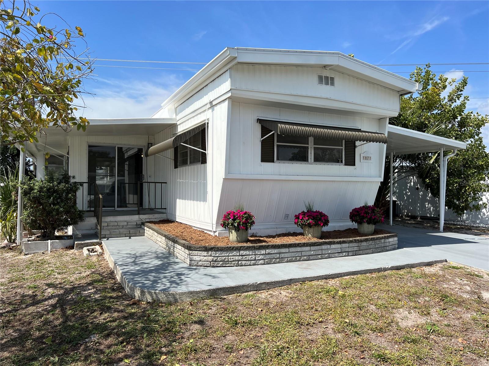 Beautifully renovated home. This 2 bedroom - 2 Bath home has a 20 X 12 screened lanai. Currently leased for $1500/mth ending 01/31/26! The home has new flooring, paint and fixtures throughout and all new appliances. Big ticket replacements include...electrical panel, hot water heater and TPO roof! Tri Par is a friendly 55+ park with lots of activity. Some activities include Thirsty Thursdays, large pool area with jacuzzi, pickleball, horseshoes, miniature golf, holiday dinners and dances, shuffleboard, and much more. It is located near the Downtown Arts District, marina, eateries, banking, hospital, shopping, airport, I-75, UTC Mall, Benderson Park and best of all the beautiful beaches always rated among the top beaches in the U.S. This park is land owned with no monthly fees, (Tri Par receives a special tax dispensation -the $1322 annual fee is paid from your property taxes each year). Make this your home, or rental and enjoy the cash flow!