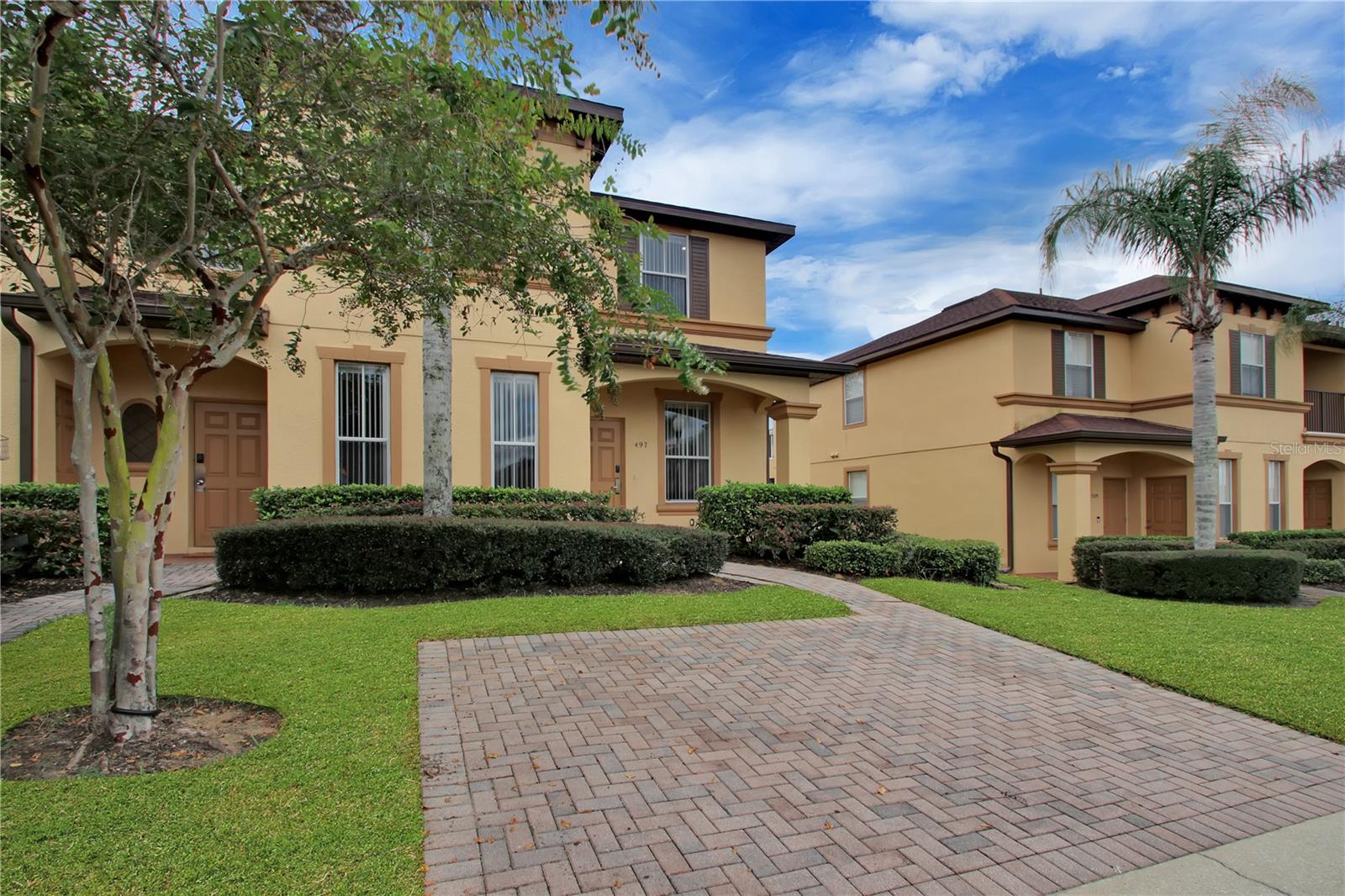 Welcome to Regal Palms Resort! This 4 bed 3.5 bath townhome in this guard gated central Florida short-term rental community is ready for new owners. Just a short drive to Disney and Universal, a great opportunity as a primary residence or vacation residence or income generating rental. New roof 2023, New hot water heater 2024. On the first floor, you have a primary bedroom with en suite bathroom, ktichen, dining room, living room with sliders to the covered patio, and a half bath. Continue upstairs for the second primary bedroom with en suite bathroom and private balcony, two additional bedrooms, a full bathroom and a laundry closet. Regal Palms Resort offers residents and guests access to the community pool with lazy river, restaurant, playground, sand volleyball court, clubhouse, fitness center, game room and more! Located just a few minutes drive to Publix, shopping, dining, restaurants and major highways for quick access to all central Florida has to offer.