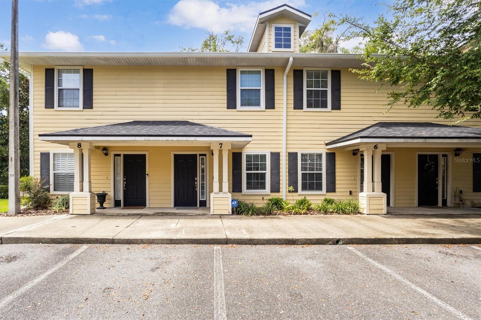 Fully Furnished Gem Near UF – 2BR/3BA + Flex Space | Immaculate & Move-In Ready!
If you are looking for a stylish, turn-key home just 1.5 miles from the University of Florida, this is it! This fully furnished 2-bedroom, 3 full bathroom home with additional flex space is your perfect match—ideal as a primary residence, second home, or rental. Step inside to a modern open floor plan featuring your living room and sleek kitchen with real wood cabinets, granite countertops, and upgraded stainless steel appliances that are less than 5 years old. No carpet here—enjoy the low-maintenance beauty of upgraded wood-look tile flooring throughout. Relax and enjoy peace of mind knowing this home has hurricane impact windows and doors, a state-of-the-art alarm system, exterior security cameras, and wall-mounted smart TVs already in place. Relax year-round on the screened-in porch, and enjoy the convenience of a reserved parking space right out front. Prime location near Shands Hospital, the UF Vet School, I-75, and the shops and dining at Butler Plaza—everything you need is just minutes away. On bus route. HOA covers the pool, roof, exterior maintenance, landscaping, internet, and trash service—making for easy, worry free living. Priced with furniture included, but seller is open to offers without furnishings. Don’t miss your chance to own this clean, secure, and beautifully maintained property in Gainesville! Schedule your private showing today and see why this one stands out!