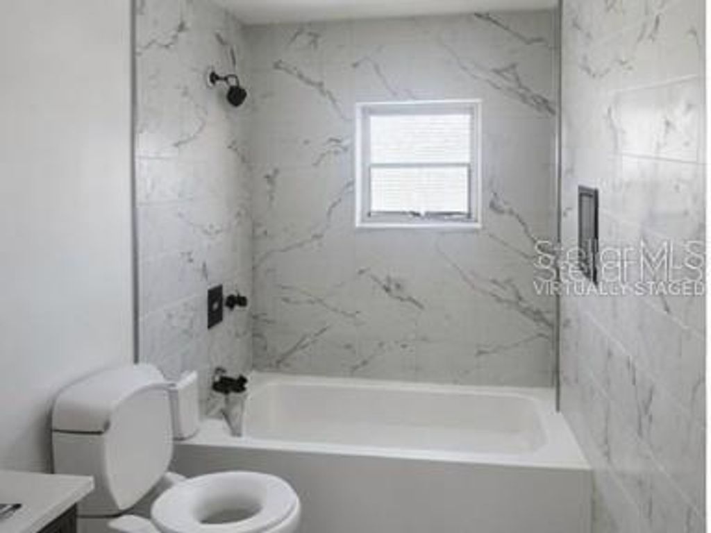 Photo of 132 Miller Drive, Winter Haven, FL 33884 (MLS # TB8481373)