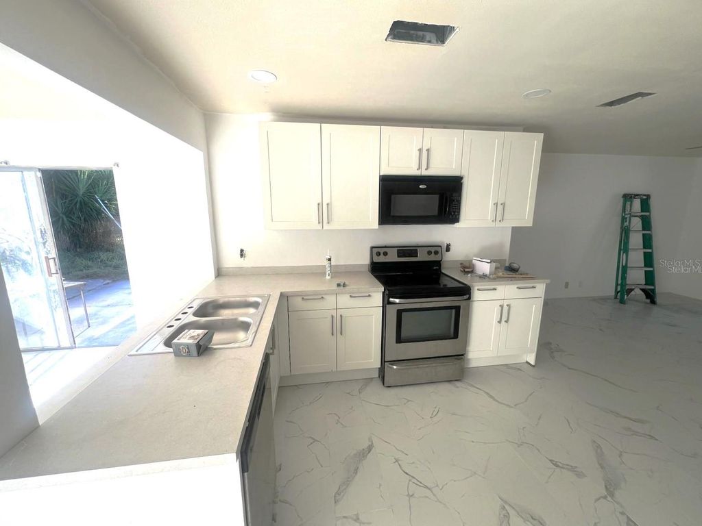 Photo of 132 Miller Drive, Winter Haven, FL 33884 (MLS # TB8481373)