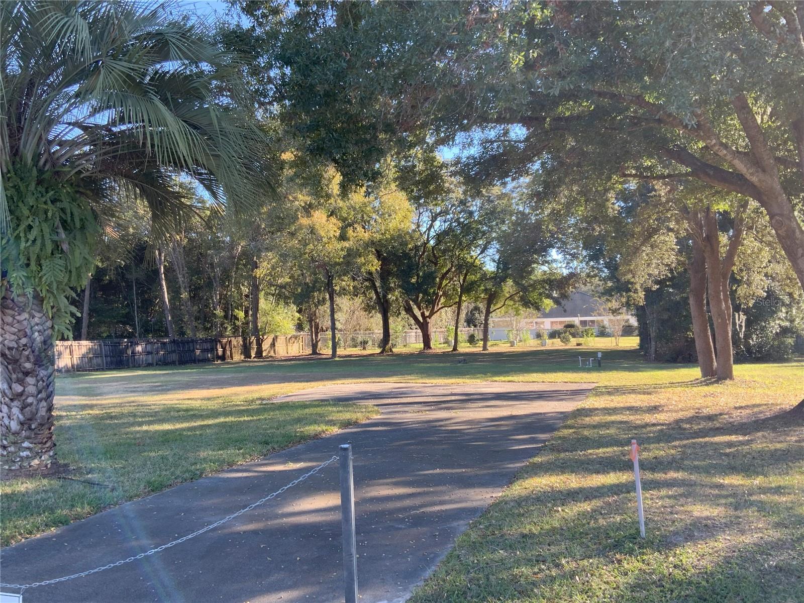 A turn key nearly half an acre property in middle of town! Established neighborhood of Kingsland Country Estates/Whispering Pine. Cleared, has a functioning well and a paved driveway. Septic was condemned when original home on property burned down. BRING REASONABLE OFFERS!