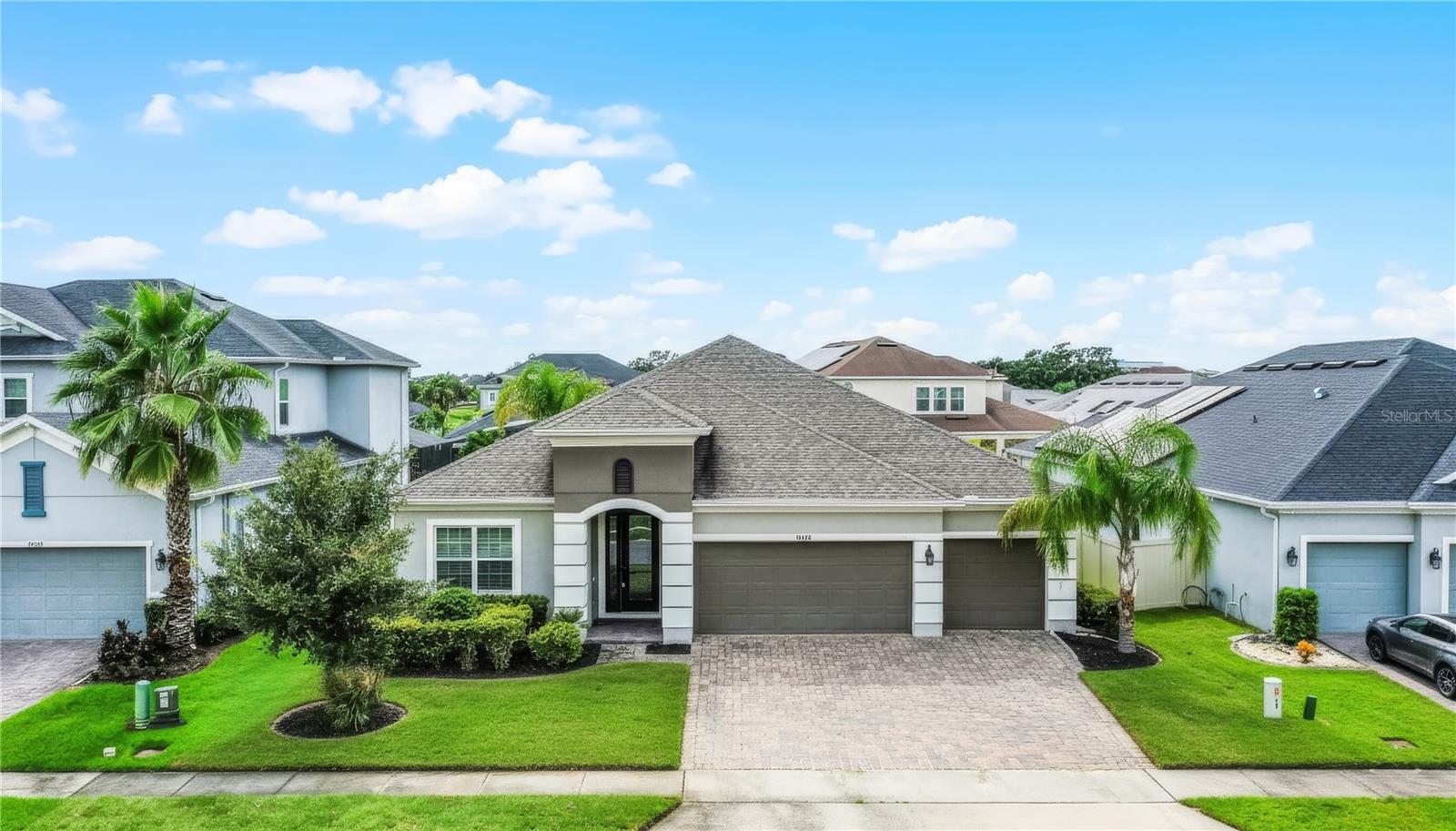 Presenting 14008 Jomatt Loop in the highly desirable Cypress Reserve community of Winter Garden. Priced at $739,900, this spacious single-family home offers four bedrooms, three full bathrooms, and a dedicated den, with nearly 3,000 square feet of living space under air on a .19-acre lot. Built in 2019, the property combines modern construction with timeless finishes, featuring a block and stucco exterior with a shingle roof that remains in excellent condition. Fresh interior paint and new sod in the front yard create a crisp, move-in-ready appearance that will immediately impress buyers.
Inside, the home’s open floor plan emphasizes comfort and functionality. The oversized living room is filled with natural light from sliding glass doors that lead directly to the screened-in lanai, creating an effortless flow between indoor and outdoor living. The kitchen is a standout feature, designed with granite countertops, solid wood cabinetry, a convenient bar area, and a gas stove for the serious cook. The thoughtful layout ensures seamless entertaining, whether hosting friends or enjoying a casual family dinner.
The primary suite is a true retreat, boasting two walk-in closets, dual granite vanities, a walk-in shower, and a soaking tub that provide both luxury and convenience. Additional bedrooms are well-sized and versatile, while the private den or study makes the perfect home office, flex room, or creative space. A three-car garage offers plenty of room for vehicles, storage, and projects, and the dedicated laundry room located next to the garage keeps household tasks tucked away yet easily accessible.
The outdoor spaces are designed with relaxation in mind. A screened-in lanai provides an ideal spot for morning coffee or evening gatherings, and while the community offers residents access to a pool and playground just steps away. The home’s curb appeal has been enhanced with professional landscaping and new sod, offering a warm welcome every time you arrive.
Cypress Reserve is a premier community with a low HOA fee of just $75 per month, which includes access to amenities that make it easy to enjoy the Florida lifestyle. The home is also zoned for A-rated Orange County schools ensuring excellent education opportunities for families.
The property is just minutes from Highway 429, providing quick connections to I-4, Downtown Orlando, and Orlando International Airport. Winter Garden Village, a premier open-air retail destination anchored by Target, Best Buy, Lowe’s, and an array of shops and dining, is less than 10 minutes away. Historic Downtown Winter Garden is also close by, offering boutiques, farm-to-table restaurants, coffee shops, the Garden Theatre, and the popular Saturday farmers’ market. For those who enjoy the outdoors, the scenic West Orange Trail provides miles of biking and walking paths, while the home’s proximity to Walt Disney World and other world-class attractions makes it perfect for anyone who wants to balance small-town charm with big-city convenience.
This home combines modern upgrades, functional living spaces, and an unbeatable location in one of Central Florida’s fastest-growing areas. With a flexible layout, nearly 3,000 square feet of living space, a three-car garage, and access to top schools and exceptional community amenities, 14008 Jomatt Loop represents a rare opportunity to secure a move-in-ready home that perfectly balances lifestyle, convenience, and value in Winter Garden.