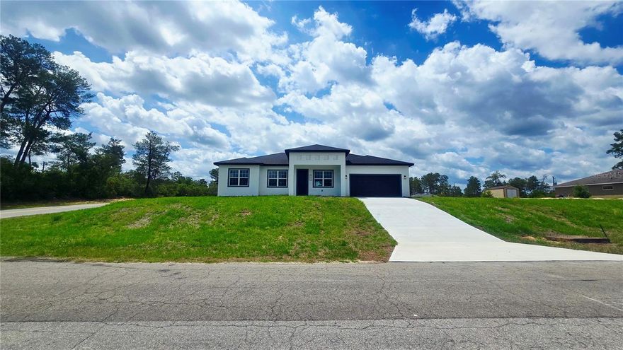 Welcome to your exquisite new home in Marion Oaks, where modern elegance meets space, privacy, and versatility.

Perfectly positioned in a quiet area of the community, this brand-new 4-bedroom, 3-bath residence sits on an oversized 0.60+ acre lot with no HOA — a rare combination that gives you the freedom to truly live the Florida lifestyle. Whether you envision building a pool, parking an RV or work truck, adding a workshop, or simply enjoying the extra breathing room, this property offers possibilities that most homes simply cannot.

From the moment you step through the impressive 8-foot front door, you’re welcomed by an airy, beautifully well-distributed floor plan with soaring 9-foot ceilings, luxurious vinyl plank flooring, and premium finishes throughout.

The gourmet kitchen is a true showpiece — featuring stunning quartz countertops with a striking waterfall island, 42-inch custom wood cabinetry, and sleek stainless steel appliances. Designed for both functionality and style, it serves as the perfect centerpiece for entertaining family and friends.

What truly sets this home apart is its ideal layout for multi-generational living or guest privacy. In addition to the expansive primary suite, the home offers a secondary master suite complete with its own private full bathroom and walk-in closet — perfect for in-laws, extended family, or long-term guests who value comfort and independence.

Each bathroom showcases meticulous attention to detail, with floor-to-ceiling tile in the shower areas and modern fixtures that exude sophistication.

The primary suite is a tranquil retreat, featuring a generous walk-in closet and a spa-inspired bathroom with dual vanities, a freestanding soaking tub, and a spacious glass-enclosed shower.

Enjoy the comfort, quality, and peace of mind of a brand-new home — all backed by the builder’s full home warranty — while living in a serene setting with room to grow, park, build, and breathe.

Discover refined living with unmatched flexibility in Marion Oaks and schedule your private showing today.