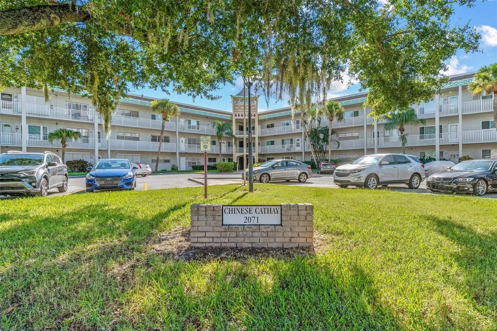 FIRST FLOOR CORNER, UPDATED, and FURNISHED, 2 bed/2 bath condo! Also, in a building that is directly across from the East side activity center. Immerse yourself in this splendor! With an abundance of upgrades, this stunning condo exudes perfection. Upon arrival, the luxury vinyl flooring will capture your attention. Soak in the natural light permeating through the updated windows. Exquisite plantation shutters complement the home. Indulge your culinary desires in this striking kitchen, featuring impressive granite countertops, soft close cabinetry, a tasteful backsplash, not to mention; stainless steel appliances! Enter the spacious main bedroom, offering a magnificent en-suite bath, upgraded with a walk-in shower and seamless doors, newer vanity and ceramic tile. The secondary bath includes the same newer upgrades. Additionally, both bedrooms feature generous closet space. Relax and unwind on either your front or rear patio, take your pick! HVAC replaced in 2022. Electrical outlet for a dryer in primary bedroom needs to be approved by the Association. Don't delay, schedule today! Assigned parking. The 55+ community has two activity centers, and two private golf courses with 9 and 18 holes, free exclusively for resident owners. There are two heated swimming pools. The remodeled Cardio Gym has the latest exercise equipment. A very pet-friendly community, there is a fenced dog park with covered seating. There are hobby studios, and a wood shop for the exclusive use of the residents. Activities include fitness classes, dancing, clubs, cards, billiards, entertainment, classes, and much more. The on-site Good Karma Café has take & bake meals and snacks. Close to beaches, transportation, shopping, entertainment, and fine dining. All room sizes, floor plans and square footage are approximate. This property is being transferred by a leasehold estate deed. Association approval is required. If financing, a 35% down payment is required.