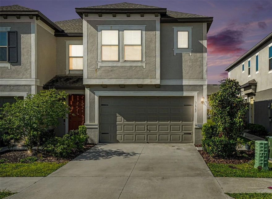 Live like you’re on vacation every day in this stunning townhome located in the resort-style Crystal Lagoon community of Epperson! This 3-bedroom, 2.5-bath, 2-car garage home features an open and inviting floor plan with a modern kitchen showcasing granite countertops, stainless steel appliances, abundant cabinetry, and a spacious pantry. The main living area flows seamlessly to a covered lanai overlooking a peaceful pond—ideal for morning coffee or evening unwinding. Upstairs, the owner’s suite offers a walk-in closet and a private bath with dual sinks and a walk-in shower. Two additional bedrooms, a full bath, and laundry complete the upper level. Enjoy exclusive access to the 7.5-acre lagoon with sandy beaches, cabanas, water slides, and a swim-up bar, plus parks and scenic walking trails. Conveniently located near top shopping, dining, medical facilities, and major commuter routes. HOA covers lawn care, cable, and high-speed internet for easy, low-maintenance living.