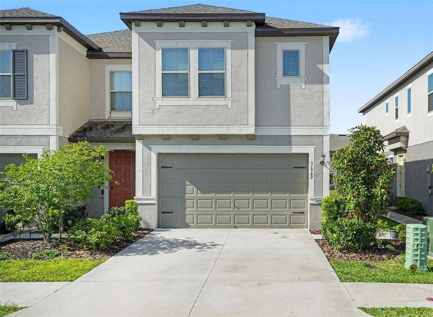 Live like you’re on vacation every day in this stunning townhome located in the resort-style Crystal Lagoon community of Epperson! This 3-bedroom, 2.5-bath, 2-car garage home features an open and inviting floor plan with a modern kitchen showcasing granite countertops, stainless steel appliances, abundant cabinetry, and a spacious pantry. The main living area flows seamlessly to a covered lanai overlooking a peaceful pond—ideal for morning coffee or evening unwinding. Upstairs, the owner’s suite offers a walk-in closet and a private bath with dual sinks and a walk-in shower. Two additional bedrooms, a full bath, and laundry complete the upper level. Enjoy exclusive access to the 7.5-acre lagoon with sandy beaches, cabanas, water slides, and a swim-up bar, plus parks and scenic walking trails. Conveniently located near top shopping, dining, medical facilities, and major commuter routes. HOA covers lawn care, cable, and high-speed internet for easy, low-maintenance living.