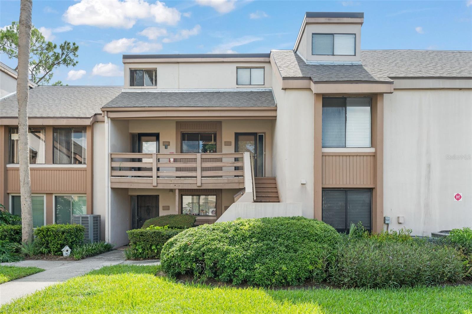 **This house comes with a REDUCED RATE through the seller's preferred lender. This is a lender-paid rate buydown that reduces the buyer's interest rate and monthly payment.** Step into style and comfort in this beautifully updated two-story condo in the heart of Altamonte Springs. With nearly 1,300 square feet of open, airy living space, this 2-bedroom, 2-bathroom home blends modern design with functional living. As you enter, you’re welcomed by a spacious living and dining area bathed in natural light from a wall of sliding glass doors that lead to a private screened in porch—an ideal spot to relax, recharge, or personalize as your own outdoor retreat. The sleek kitchen is a true standout, featuring white cabinetry, striking stone countertops, and a chic mix of black and stainless steel appliances. Conveniently located nearby, the laundry area includes washer and dryer hookups to make everyday chores a breeze. Tile and laminate flooring flow throughout the home, providing a clean, low-maintenance foundation for your personal style. Upstairs, a dramatic wire railing draws your eye upward to soaring ceilings and a versatile loft space perfect for an office, lounge, or creative studio. Just off the loft is a fully updated bathroom with a stunning floor-to-ceiling tiled walk-in shower, and an additional bonus space that offers even more flexibility. The primary suite, located just off the entryway, offers privacy and comfort with dual built-in closets and a modern ensuite bath, also finished with striking tilework. Located in a quiet, well-situated community near Lake Orienta and all that Altamonte Springs has to offer, this home is a stylish blank canvas ready for your personal touch. Whether you're a first-time buyer, downsizing, or investing, this is a rare opportunity to own a turnkey space that feels anything but ordinary.