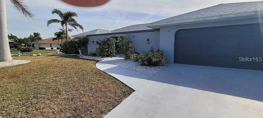 Photo of 1840 Flametree Lane, Venice, FL 34293 (MLS # O6435114)