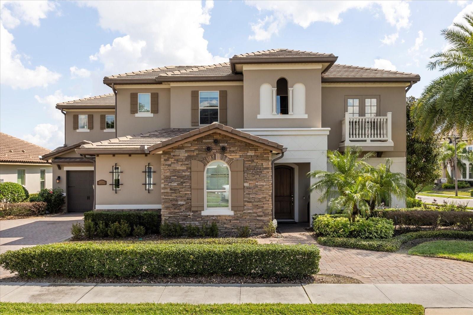 One or more photo(s) has been virtually staged. Stunning “Granada Plan,” resort-style home in the heart of the gated Steeple Chase Community located in Lake Mary. Craftsman woodworking detailing throughout the home, and adorns this private, outdoor retreat from the tongue and groove wood ceiling in the expansive lanai to the decked-out summer kitchen including natural gas stove and grill, frig, and attractive, gas-lit coach lights. You can enjoy your saltwater pool and heated spa while relaxing in the outdoor bar. It's equipped with beer taps, storage, and a sink with plenty of seating options. A fence line of mature Podocarpus shrubs surrounds this secluded outdoor space, and this area boasts surround sound speakers as well as mosquito control using all-natural products. Upon entering, you will find a well- organized open concept. The gourmet style kitchen has a dual oven/microwave combo, a center island for extra prep space, tons of counter space sure to please, a walk-in pantry, and a farmhouse sink. Unique to this home is a secluded wine room, with a wrought iron door entrance and window feature, welcoming you to the custom cabinetry and solid surface tops with its own beer tap . Enjoy the generous great room overlooking the outdoor pool area. The oversized, private, first-floor master suite includes walk-in closets and a luxurious shower. It also has a soaker tub, dual vanity, and a water closet. First-floor office, with custom-built storage, wood floors, and a shoe cabinet has flexibility to be a guest room. Upstairs, there are 4 bedrooms and 3 full bathrooms as well as a loft area that includes a beautiful built-in wall unit. The first- floor laundry room accesses the single-car garage as well as the driveway. A separate 2-car garage includes ceiling storage for all your needs. All this with an incredible location nearby to great schools, world-class dining, shopping, and a bustling business district and all major highways. This property may be under audio/visual surveillance. Call today for your private home showing.