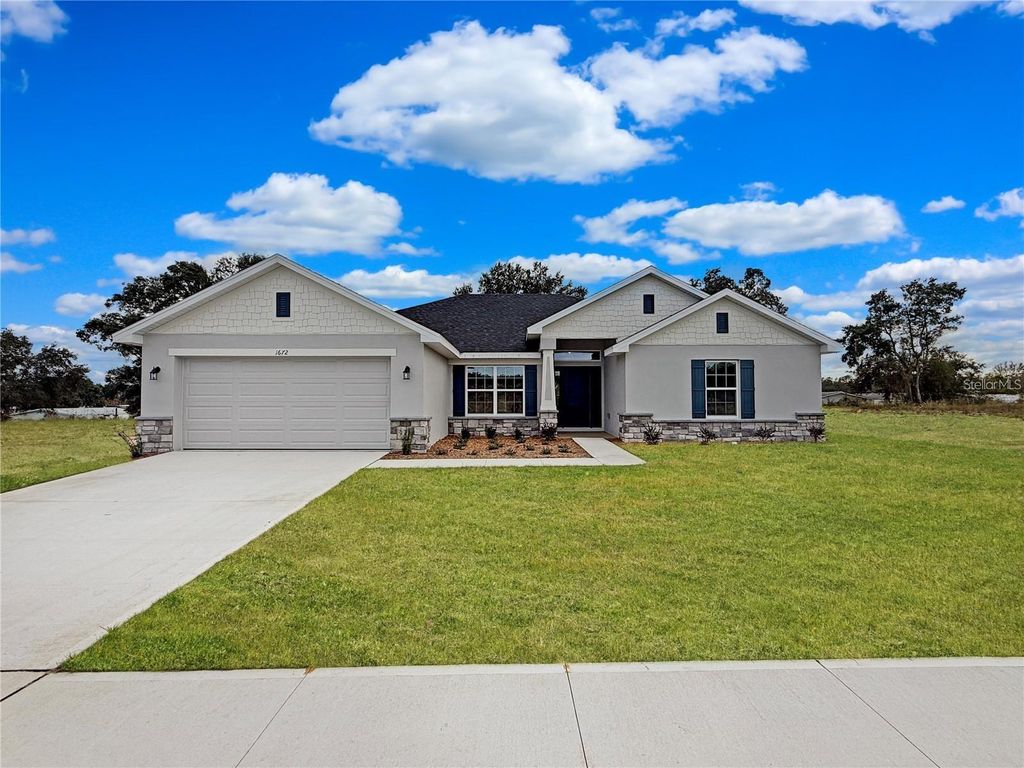 Photo of 1676 Ann Rose Way, Leesburg, FL 34748 (MLS # O6423068)
