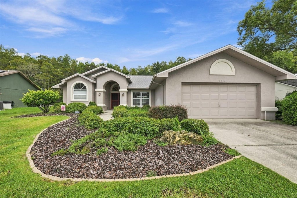 Photo of 8657 Cypress Lakes Boulevard, New Port Richey, FL 34653 (MLS # A4708172)