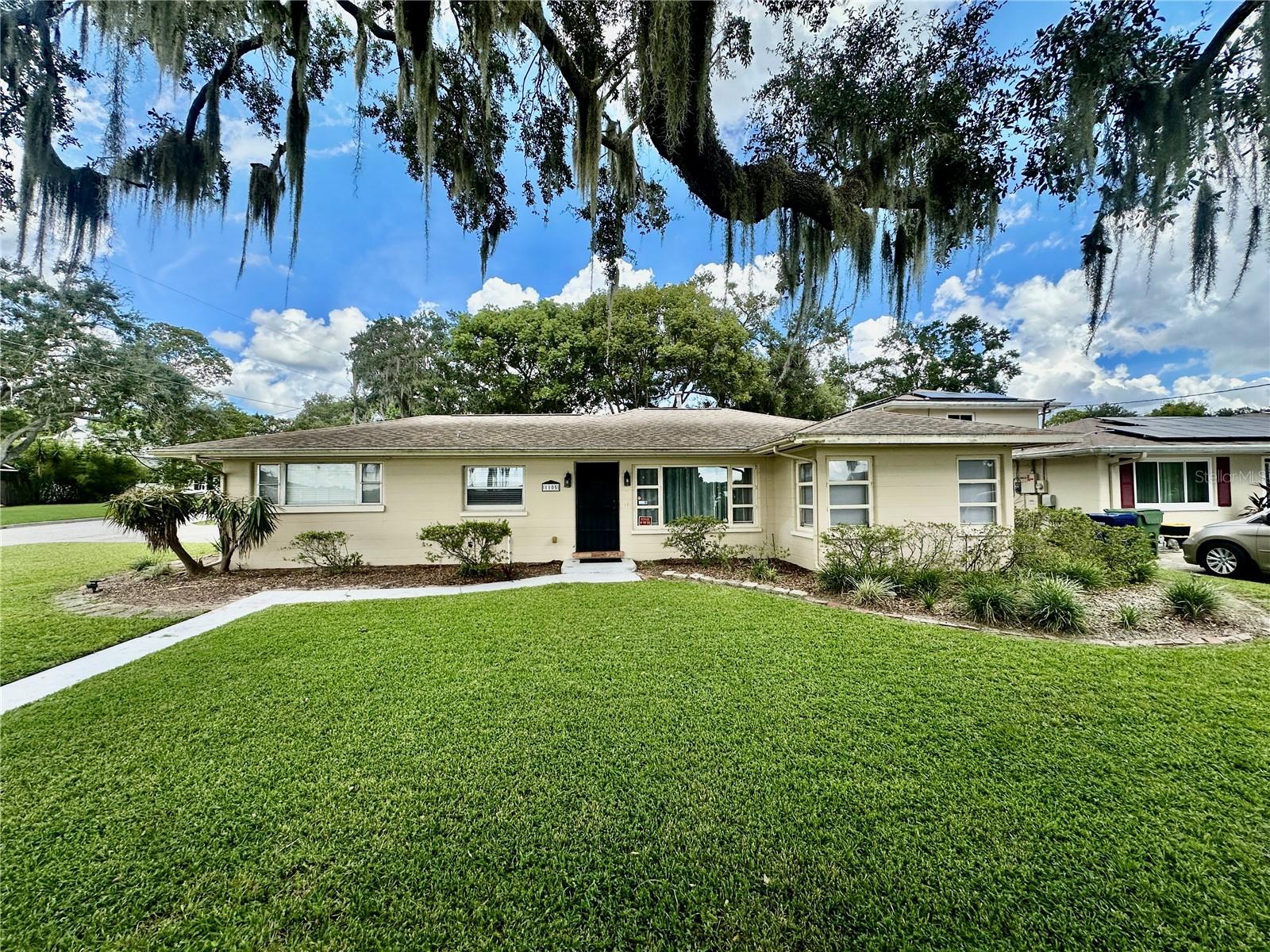 Charming 3-Bedroom, 1-Bath Home on a Spacious Corner Lot, Conveniently Located Near Town. This well-maintained home features terracotta tile flooring throughout, with carpeting in two of the bedrooms for added comfort. The bright and airy living room flows seamlessly into a separate dining room, perfect for family gatherings and entertaining. A dedicated mud room at the carport entrance offers convenience and practicality. The property includes a one-car carport with built-in storage cabinets and a washer/dryer for added ease. The large backyard has a small fenced area and provides a private oasis for relaxation or outdoor activities Don't miss out on this delightful home in a prime location—schedule your private showing today!