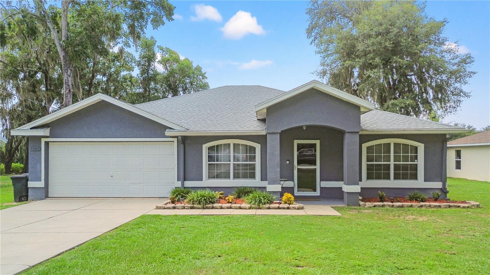 This spacious 3 bedroom 2 bath split plan home with a two-car garage is located on a quiet street in Ocala Park Estates. Step into almost 1800 square feet of open, airy living with a formal living and dining room. The kitchen has a large eat in area and breakfast bar that is open to the family room. This home is made for lazy Sundays and lively barbecues with a 26'x10' screened back porch and a backyard with no rear neighbors. Come make this turnkey well maintained (including a new roof in 2022) home with stylish modern updates throughout yours today.