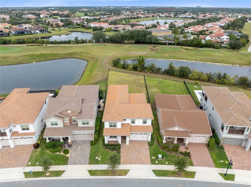 Positioned on one of the most desirable pond and golf view lots in Eagle Creek, this 2022 Jones Homes Oakmont with Bonus offers exceptional scale, layered outdoor depth, and elevated indoor outdoor living rarely available in the community. With 3,849 square feet of refined design, soaring ceilings, and a premium fenced homesite, this residence blends modern elegance with resort style living inside Lake Nona’s premier gated golf community.

The Spanish Mediterranean exterior with tile roof and paver driveway creates a striking first impression. Inside, expansive tile flooring on the main level pairs beautifully with Mohawk engineered wood throughout the entire upstairs, including solid wood stairs, a significant upgrade that enhances both durability and design continuity. Recessed lighting and a soft neutral palette create a bright and sophisticated interior.

The open concept layout flows effortlessly, anchored by a stunning oversized island kitchen featuring stone countertops, stainless steel appliances, abundant cabinetry, and a spacious walk in pantry. Large sliding glass doors frame serene pond and fairway views, seamlessly connecting indoor and outdoor spaces.

The first floor primary suite is a private retreat with tranquil rear views and generous proportions. The spa inspired bath features a long dual sink granite vanity with dedicated makeup station, a linen tower for added storage, and an oversized glass enclosed shower with dual shower heads, including a rain feature. The expansive walk in closet connects directly to the laundry room for everyday convenience. A secondary bedroom and full bath on the first floor provide ideal flexibility for guests or multigenerational living.

Upstairs, a dramatic open loft serves as a second living space and opens to a covered private balcony overlooking the backyard, pond, and golf course beyond. This elevated outdoor retreat is perfect for morning coffee or evening sunsets. The level continues into an extraordinary oversized bonus room offering endless possibilities for a theater lounge, golf simulator, game room, fitness studio, or executive office suite. Two additional bedrooms and a full bath complete the upper level.

Step outside to a covered paver lanai designed for year round entertaining, overlooking an expansive fully fenced backyard that stretches toward tranquil pond views and manicured fairways beyond. With no direct rear neighbor and exceptional lot depth, this property offers a rare sense of privacy and scale within Eagle Creek. The layered backdrop of lawn, water, and golf course creates a serene and elevated setting that truly sets this home apart.

Thoughtfully upgraded beyond builder standards, the home includes premium enhancements such as electric vehicle charging capability, smart home features, upgraded electrical capacity, enhanced security, HVAC UV filtration, and water efficient landscaping, delivering modern comfort, efficiency, and peace of mind.

 

Located within the gated Eagle Creek community featuring championship golf, resort style amenities, top rated schools, and convenient access to Medical City, major highways, and Orlando International Airport, this is a rare opportunity to own one of the most premium lots in the neighborhood.