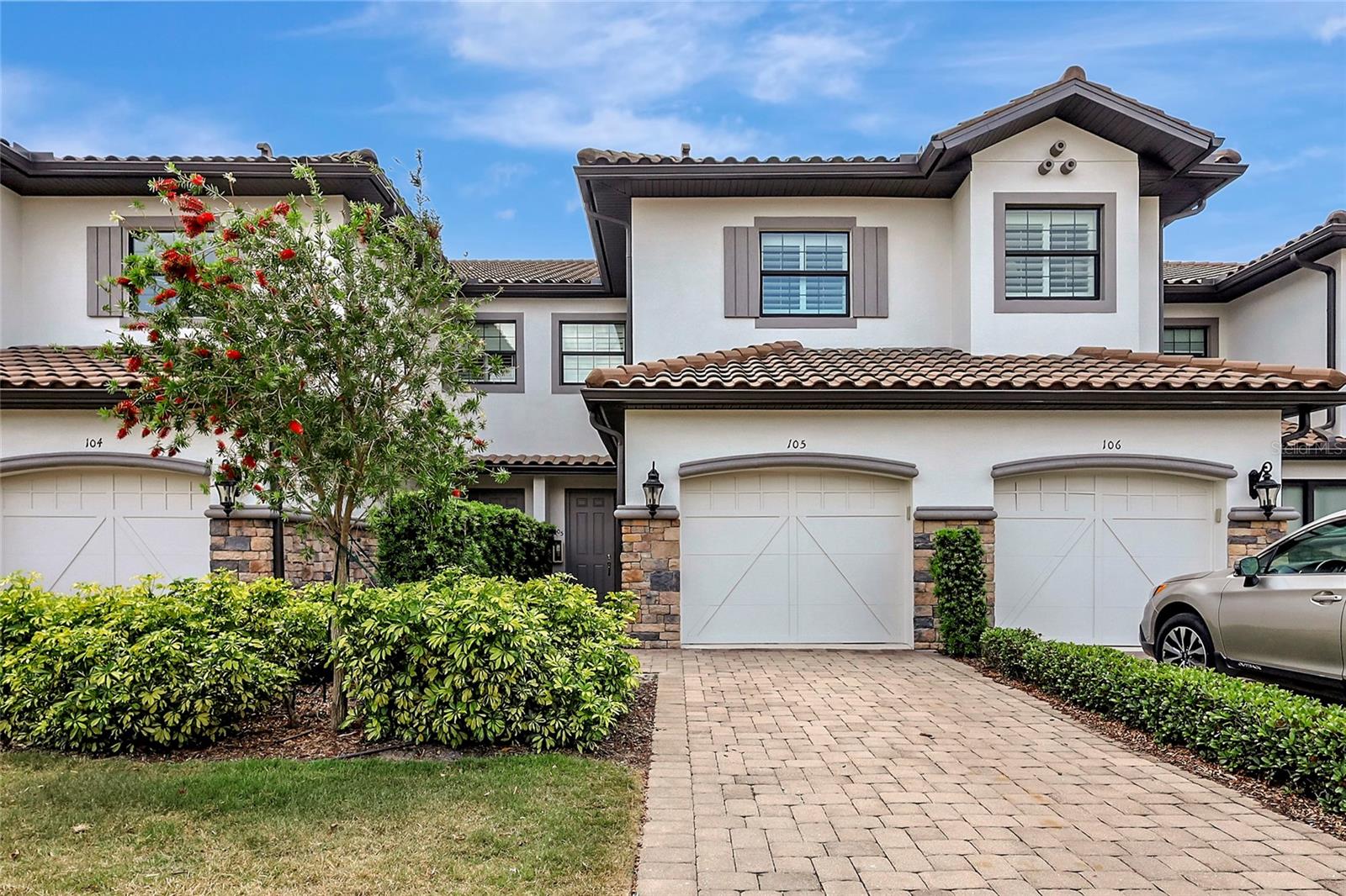 Resort style living is right around the corner for you! Esplanade Golf & Country Club is the premier luxury resort-style community nestled in the heart of the ever-growing Lakewood Ranch. With a 12 minute drive from Lakewood Ranch Main Street and a 5 minute drive from the surrounding shopping plazas, Esplanade has a convenience factor that has held true for the neighborhood's entirety. To pair with this unbeatable convenience; Esplanade is home to an 18-Hole Championship Golf Course, Up-to-Date Fitness Center, 2 Clubhouses, Wellness Center/Spa, Activity Coordinator, Playground, Dog Park, 2 Resort Pools, Resistance Pool, Pickleball/Tennis/Bocce Ball Courts, the Bahama Bar, and a Culinary Center. In the Culinary Center there are multiple dining options from bar, cafe, wine/beer tastings, to cooking classes!
This RARELY available for lease, "Lock-n-Leave" Vitale Coach Home, on the FIRST FLOOR with an ATTACHED GARAGE greets you with a remarkable open layout floor plan once walking in the front doors. Featuring a large centered living area with coffered/tray ceilings and a fireplace that will make you feel right at home. From here you are greeted by pocketing slider doors that take you out to the rear of the home where a large screened patio awaits with ample seating area for friends and family and a private greenbelt view. Having the two oversized bedrooms gives the ability of a dual or single arrangement of the suites, as one has a walk-in closet and the other supports a built-in closet. The gourmet kitchen features a large center island that doubles as a pre-station; surrounded by large granite countertops and topped with stainless-steel appliances to finish everything off. This coach home is a one-of-a-kind find.