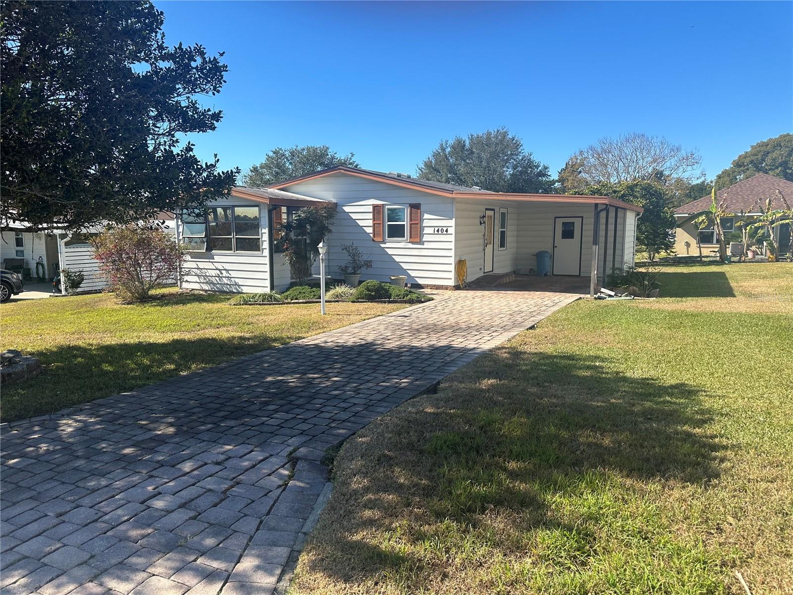Charming 2-Bedroom, 2-Bath Double Wide – Land-Owned in Premier 55+ Community
Discover relaxed Florida living at its best in this beautifully maintained 2-bedroom, 2-bath double wide manufactured home located at 1404 Plantation—where you own the land and enjoy the benefits of a vibrant 55+ community with no lot rent.
This spacious home features a bright, open layout with a welcoming living area, a well-equipped kitchen with ample storage, and a cozy dining space perfect for everyday meals or entertaining. The primary suite offers a private bath and generous closet space, while the second bedroom is ideal for guests or a home office.
Step outside to enjoy your private yard, covered carport, and storage shed—perfect for gardening, hobbies, or simply relaxing in the Florida sunshine.
As part of a highly sought-after active adult community, you'll have access to resort-style amenities including a swimming pool, golf course, recreation center, tennis and pickleball courts, and numerous clubs and social activities to keep you engaged and connected.
Whether you're looking for a seasonal retreat or a full-time residence, this home offers comfort, convenience, and a true sense of community—