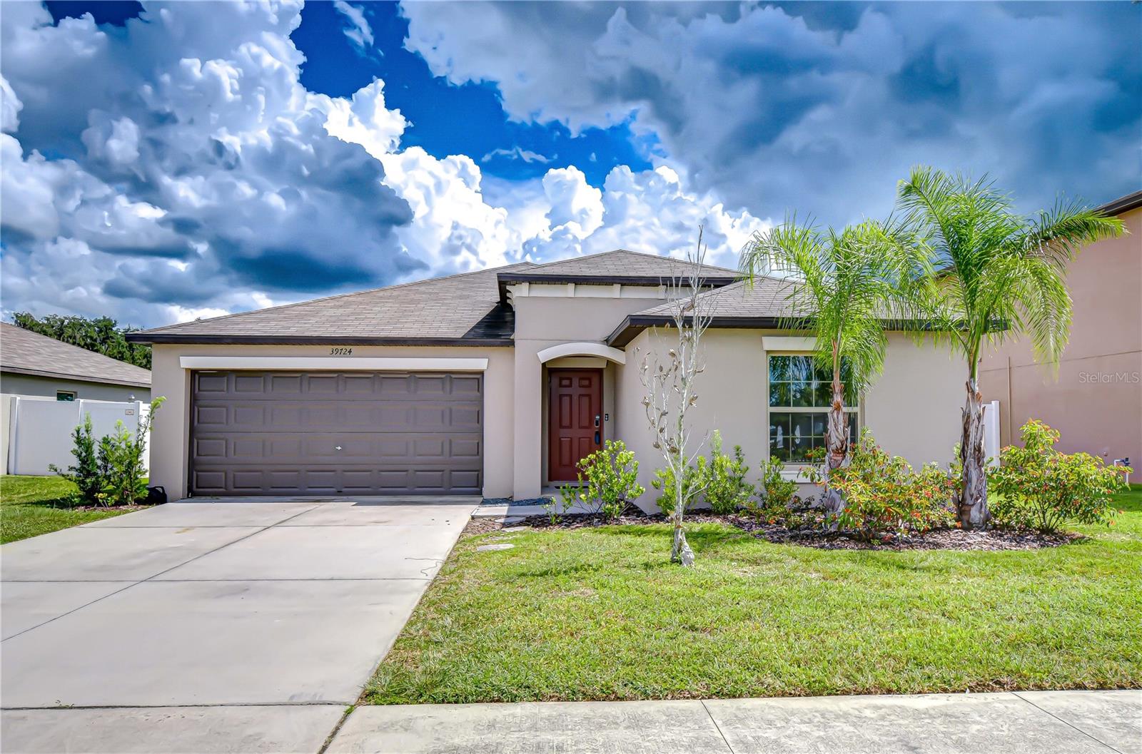 Welcome to Hidden River, one of Zephyrhills’ most desirable communities where lifestyle and convenience come together. This 4-bedroom, 2-bath single-family home offers modern living with thoughtful design, all without the burden of a CDD.
Step inside and enjoy a bright open floor plan with a seamless flow from the dining area to the spacious living room. The split-bedroom layout ensures privacy, while tile in all wet areas and plush carpet in the bedrooms balance style and comfort. The home also features an inside laundry room and a two-car garage for added ease. Unwind on your back patio with serene pond view or explore the community amenities including a dog park and nature trails. Hidden River also includes cable and internet with the HOA, making life here even more convenient. Built in 2021, this home offers peace of mind with a 2021 roof and AC. Perfectly situated near local parks and just steps away from the baseball field, you’ll enjoy being part of the vibrant and growing Zephyrhills community. Whether you’re looking for your first home, a place to raise a family, or a retreat in an up-and-coming town, this home delivers it all. Come check it out, let this home be your next step in joining our Pasco County community.