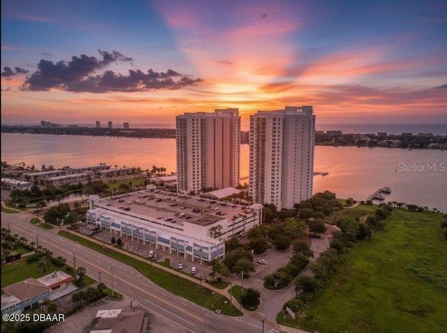 Million dollar views await at Marina Grande on the Halifax, offering luxury condo living with panoramic sights of the Atlantic Ocean and Halifax River. This spacious 2-bedroom, 2-bath split floor plan sits in a gated community and showcases an impressive primary suite with two walk-in closets featuring custom shelving. Enjoy direct balcony access and a stunning primary bathroom complete with dual vanities, a walk-in shower, jetted tub, white cabinetry, and marble counters and flooring. Recent upgrades include vinyl flooring in the main living area, granite kitchen countertops, upgraded backsplash in kitchen, a beautifully updated tile walk-in shower in the primary bath, and a new all-in-one washer and dryer that maximizes space. The guest suite is generously sized and offers excellent privacy. Additional perks include a prime parking space, #501, located on the 3rd floor for easy access.

This is a very affordable condo with AMAZING amenities: 7 Day Concierge, 24hr Guarded-gated access with more than 10,000 sq. ft of amenities. Live the Condo luxury life with a movie theater, party room, fitness center, a yoga/Pilates/dance studio, steam rooms, billiards room, game room, library, Wi-Fi, full-time concierge, hot tub, 2 beautiful POOLS and lots of social events. Assigned garage parking and storage area. Enjoy maintenance free waterfront living at the fabulous MG on the Halifax and you almost never have to leave the condo!