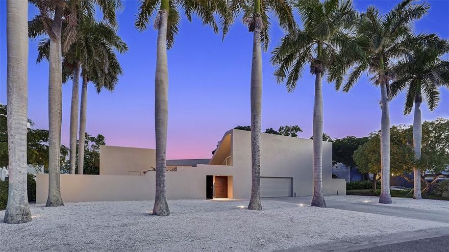 SARASOTA MODERN IN COVETED LIDO SHORES. First time on the market! This award- winning design by architect Carl Abbott is recognized in multiple architectural books and magazines for its distinctive design features and stunning views of the water. Greeted by a colonnade of Royal Palms, the residence is very private from the road. Custom carved doors lead to a shell covered entry court. The glass entry door introduces you to the panoramic views of Pansy Bayou through expansive walls of glass. A great home for entertaining, the large pool and spacious deck and dock cascade down to the water. A spacious and open living floor plan is accentuated by varied ceiling heights stepping up from 10 ft in kitchen and dining areas to 12 ft in the living area to a soaring 14 ft in the art studio. A spacious and flowing main living area has breathtaking views of the bayou and includes the kitchen, marble floors, office with built-in bookcases, and hidden mirrored bar. A master bedroom suite continues with wonderful views of the bayou and has two full travertine baths and a soaring skylighted shower. The 70 ft long art studio space has multiple possibilities: extra bedrooms, fitness room, family room, in-home workspace, etc. A two-bedroom guest suite with laundry and kitchenette is accessed through a private entrance in the courtyard and offers the perfect setup for a private extended family stay or a live-in opportunity. Half a block away is the private gated beach on the Gulf of Mexico. With a bocce court and gazebo, this is a favorite gathering place for the residents of Lido Shores to enjoy the famed Gulf of Mexico sunsets. This iconic residence is ideally located just minutes to St. Armands Circle for fine dining and shopping, yacht clubs and the Longboat Key Club, Downtown Sarasota and its outstanding arts community. Room Feature: Linen Closet In Bath (Primary Bedroom).