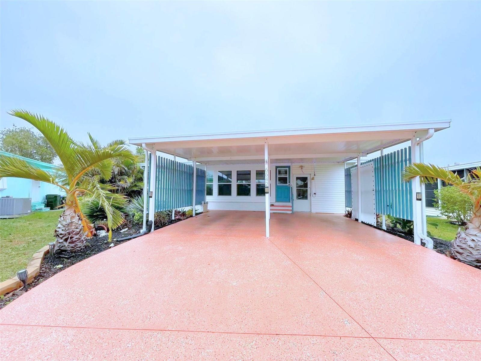 MOTIVATED SELLER – BRING OFFERS! YOU OWN THE LAND, and YOU CAN GET A MORTGAGE
Welcome to 6642 Acacia Ct., a beautifully LARGE upgraded 2-bedroom, 2-bath doublewide manufactured home with a CLOSED-IN FLORIDA ROOM UNDER AIR located in the desirable 55+ gated community of Holiday Park, where you OWN THE LAND—NO HOA fees and NO hurricane damage! Nestled on a quiet cul-de-sac in the PET SECTION, this spacious home offers 1,620 sq. ft. of stylish, move-in-ready living space, ideal for those seeking comfort, convenience, and an active lifestyle.
Step into the air-conditioned Florida room, recently converted into a bright enclosed sunroom featuring all-new windows, a mini-split system for heating and cooling, an exterior door, and sliding glass doors—perfect for relaxing or entertaining.
Inside, you’ll find a stunning, fully updated kitchen with quartz countertops, a stylish backsplash, soft-close cabinetry, and sleek black stainless-steel appliances (4 years old, excluding fridge). With three pantries, an upgraded sink and faucet, and a whole-house sound system, this kitchen offers both form and function.
The spacious master suite is a peaceful retreat with three large windows, high ceilings, and a built-in closet. The master bath has been fully remodeled with dual vanities, new faucets and light fixtures, and a luxurious walk-in shower with glass doors and custom tile. The guest bedroom includes a triple closet with built-in drawers, and the guest bath features a shower/tub combo with ample storage space.
Enjoy the convenience of an indoor laundry room, which has been replumbed and upgraded with upper cabinets for added storage. The oversized carport is one of the largest in the park, and outside you'll also find a large utility shed, concrete patio, and sidewalk wraparound for easy access to the home.
Additional upgrades include:
Roof (2023) rated for up to 165 mph winds
Storm Stopper hurricane shutters (up to 160 mph protection)
New plantation shutters, windows, tile, and luxury vinyl plank flooring
Fresh paint, crown molding, and lush landscaping with fruit trees
This home combines modern upgrades with the charm and ease of Florida living. The low monthly maintenance fee of $195 ($2,340/year) is included in your taxes and gives you access to an impressive list of community amenities, including:
2 heated pools
2 clubhouses
Fitness center
Library
Pickleball, tennis, shuffleboard, bocce, horseshoes, billiards, and more!
Located just minutes from shopping, dining, entertainment, golf courses, airports, and Florida’s world-famous beaches, this home offers the perfect balance of relaxation and activity—all without the hassle of an HOA.
Don't miss your chance to own this gem in Holiday Park—schedule your showing today!