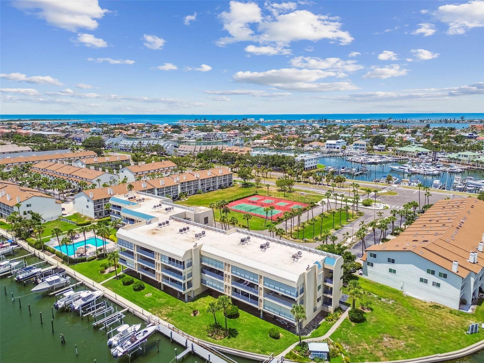 Welcome to the beautiful island of Tierra Verde! This stunning top-floor end-unit condominium offers two bedrooms, one full bath, and an additional half bath, all set against the backdrop of sweeping views of Tampa Bay. From the moment you enter, you’re embraced by the calm and charm of island living. The bright, open-concept layout features a spacious living room that flows seamlessly into the dining area—ideal for entertaining—connected to a well-appointed kitchen. A luxurious walk-in shower, cozy electric fireplace, and an expansive balcony—ideal for enjoying warm breezes and water views—complete the picture of comfort. The community pool offers a peaceful spot to unwind or soak up the sun. Over a mile from iconic Fort DeSoto Park, the Tierra Verde community also features a quaint downtown with a variety of restaurants and local shops. For boating enthusiasts, the island offers two marinas with options for boat slip rentals or high-and-dry storage. You’re just minutes from the pristine shores of Pass-a-Grille and St. Pete Beach, with easy access to Interstate 275, placing downtown St. Petersburg just 10 minutes away, and Tampa International and St. Pete/Clearwater airports within a 20–30-minute drive. This is island living at its finest so contact me today to schedule your private showing.