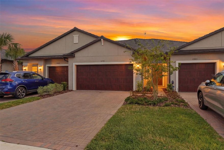 Welcome to 10799 Gable Dig Loop, a like-new villa in the highly sought-after 55+ community of Medley at Mirada—offering the perfect opportunity to skip the wait and extra costs of new construction and move right into resort-style living. This beautifully maintained 2 bedroom, 2.5 bath home features an open-concept layout with a desirable split floor plan, plus a versatile upstairs loft ideal for a home office, hobby space, or guest retreat. Both bedrooms are generously sized, providing comfort and privacy for residents and visitors alike. The spacious primary suite boasts dual vanities, a glass-enclosed shower, private water closet, and a large walk-in closet. The kitchen seamlessly connects to the dining and living areas, creating an inviting space perfect for entertaining. Step outside to your covered, screened lanai with serene pond views—an ideal setting for relaxing mornings or evening gatherings. Thoughtful upgrades include a water softener and epoxy-coated garage and lanai floors. The home has been meticulously cared for and tastefully decorated, reflecting true pride of ownership. Residents of Medley enjoy exclusive access to a private clubhouse featuring a resort-style pool, state-of-the-art fitness center, pickleball courts, restaurant, two bars, card room, event hall, and a variety of social and recreational spaces. HOA fees also include membership to Mirada’s incredible 15-acre lagoon, complete with a swim-up bar, kayaking, paddleboarding, waterslides, obstacle course, cornhole, and year-round events. Additional HOA benefits include exterior maintenance (roof and walls), structural insurance, lawn care, and cable—providing peace of mind and low-maintenance living. Conveniently located near shopping, dining, hospitals, and I-275, this home is perfect for full-time living or a seasonal getaway. Schedule your private showing today and start enjoying the vibrant, active lifestyle you deserve!