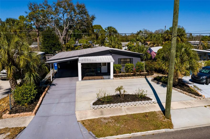 Beautiful, meticulous and updated 2-bedroom, 1-bathroom home with tropical landscaping in the NON-FLOOD ZONE area of Jungle Terrace just down the street from Walter Fuller Park and close to Boca Ciega Bay.
Step into your own private oasis—this vibrant coastal retreat is a rare gem! Imagine sipping cocktails at your personal tiki bar, and unwinding to the gentle glow of festive, colorful lights that transform the back patio into a paradise after sunset. The lush, mature landscaping creates a secluded haven, perfect for lively gatherings or tranquil evenings.
This well-maintained property includes a WHOLE HOUSE WATER FILTRATION SYSTEM and a REVERSE OSMOSIS SYSTEM in the kitchen, DOUBLE PANE WINDOWS WITH HURRICANE PANELS, OPEN FLOOR PLAN and a CIRCULAR DRIVEWAY that can accommodate 3-4 cars plus the CARPORT. 
You’ll love entertaining on the back patio deck that’s surrounded by lush tropical plants, a tiki bar and an array of colorful lights for nighttime enjoyment. There’s also a private outdoor shower on the side of the house and a large shed.
The inside is spectacular! Updated open kitchen with a breakfast bar, island with pull out shelves, Stainless Steel appliances, granite counters, pantry, GFCI outlets, an extra water purification system and the dining area overlooks the lovely backyard. The cozy office/den provides a built-in bar with a wine refrigerator, desk, queen sleeper sofa, barn doors for privacy while being used for an additional sleeping area and a view of the backyard. 
An updated bathroom with a dual flush toilet, exhaust vent & GFCI outlet compliments the home. The comfortable living room is a corner room as well as both bedrooms. There's tile flooring in the main living areas. Flood insurance is not required.
This wonderful property is only a 9-minute drive to the beach on the Gulf of Mexico for fun and sun, a couple of minutes to Tryone Mall for exceptional shopping & dining (including Home Depot & Best Buy), 2 minutes to the boat ramp down the street and 17 minutes to downtown St Petersburg with its unique restaurants, world-class museums and the exciting pier on Tampa Bay. Let’s also mention again that this home is just down the street from Walter Fuller Park that has walking trails with bridges, a lake, baseball & soccer fields and a community center and pool. This is your place in paradise!