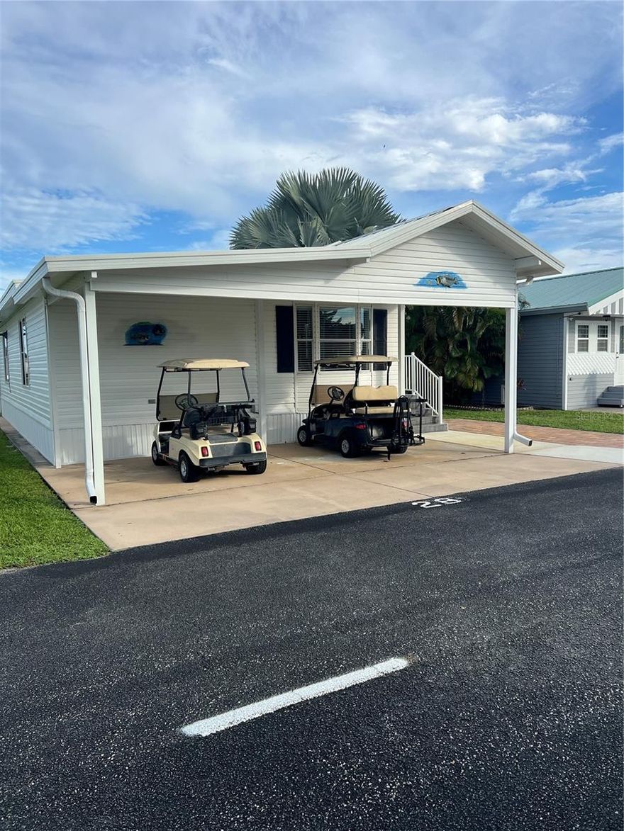 ~Blue Cypress Golf & RV Resort~  Sits on the 6th hole golf course. 2 Bed 2 Bath newly remodeled with an addition added on, New bathroom, comes completely furnished with washer & dryer. Ceramic Tile flooring. Screened in back porch with composite decking and on front porch also. Electric fireplace- big screen TV. Metal roof- New pavers for extra parking. Outside storage shed- loaded with all your needs, some tools.
2 Club car golf carts- one is newer. Even has golf clubs for a round of golf! Bring the boat, carport with 2 places plus extra parking, front view is a beautiful pasture with cattle!