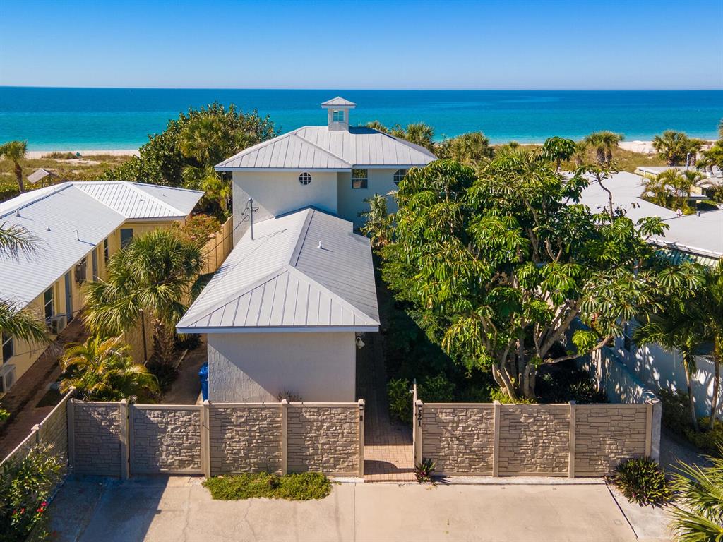 Directly on the Gulf of Mexico, your beach house awaits! Well-suited to everyday living and relaxed entertaining, 50 feet of sandy beachfront and the famous turquoise blue water is the perfect backdrop for your escape. With 3 bedrooms and 3 en suite baths, this home offers a chic casual flair, where the dream of your toes in the sand is just steps from the back door. The entire 2nd story is dedicated to a spacious master suite and balcony overlooking the beach and turquoise waters of the Gulf. This home is located in the only commercial zoned district of coveted Casey Key where opportunity abounds for leasing cash flow. Walking distance to restaurants, marina, boat and jet ski rentals and just minutes to grocery stores, Starbucks, great shopping and golf, there’s so much to love. Private and commercial air travel options are conveniently located just 15 minutes to Venice and 30 minutes to Sarasota. Life is short, buy the beach house!