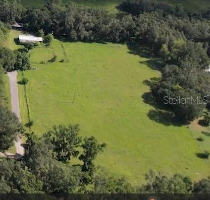 Discover the perfect blend of wide-open space and timeless Florida charm on this 5.3-acre property. Nestled among majestic, mature oak trees and surrounded by open pastures, this land offers a peaceful, private retreat with endless possibilities.
The property is completely fenced and ready for livestock, horses, or simply your own slice of country paradise. An existing dilapidated home sits on the property and will need to be removed, providing a fresh start for you to design and build your dream home exactly as you envision it.