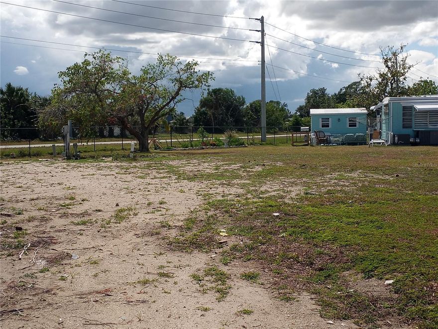 MORE ROOM FOR YOUR MONEY!  OVERSIZED VACANT LOT in the land owned, deeded community of Holiday Park. One of the largest building lots located on a quiet cul-de-sac in a pet friendly area of the park. Lot is already connected to electricity, water and sewer. and ready for a new home. Holiday Park has a low monthly maintenance charge of $129.52 ($1556.16 per year) which is included in your tax bill.  The community features two clubhouses, two swimming pools, a library, a fitness center, tennis, pickleball & bocce ball courts.  You’ll also find billiards, shuffleboard, horseshoe pits, ping pong tables, a card room, dart boards and social activities all in a park-like setting.