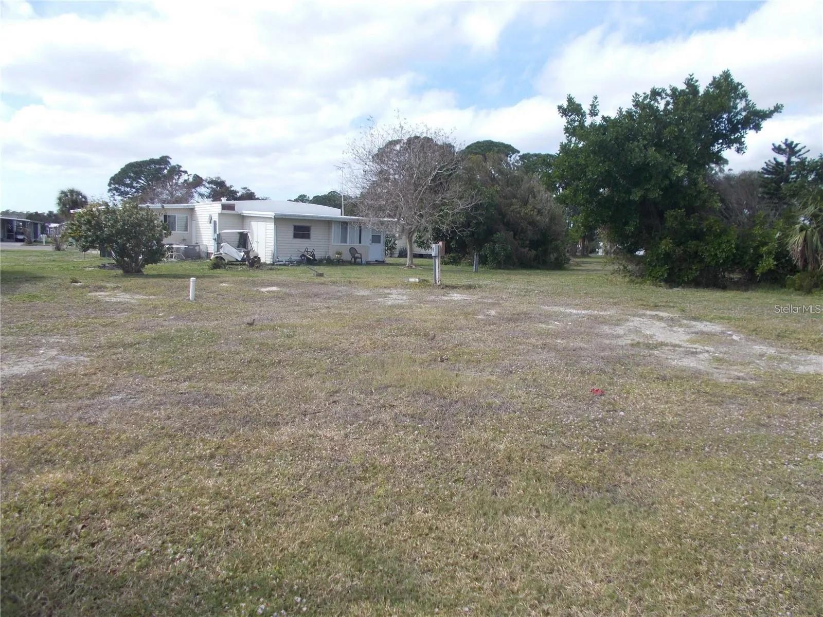 HOLIDAY PARK , PARK AND RECREATION DISTRICT is a community intended and operated as "housing for older persons" located in North Port, FL. The community consists of two phases with 865 home sites. Active adults can make use of 3 tennis courts, 4 pickleball courts, 6 horseshoe pits, 14 shuffleboard courts, 2 heated swimming pools,3 bocce ball courts, billiards, ping pong, fitness center, library, and more! This lot is on a cul de sac and is ready for you to place your manufactured home on it! Close to shopping and restaurants.