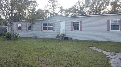 Photo of 151 West Loop, Oak Hill, FL 32759 (MLS # O6378819)