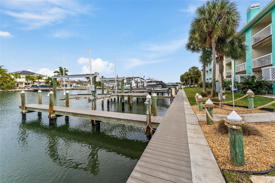 Welcome to this fully renovated, like-new coastal contemporary waterfront townhome in the coveted Sunset Bay community—an exclusive 30-residence boutique enclave with no short-term rentals, ensuring privacy, tranquility, and true neighborhood charm. Perfectly positioned along the Intracoastal Waterway, this 3-bedroom, 3-bath residence offers panoramic water views, a private boat slip with 12,000-lb lift, and effortless indoor-outdoor living designed for the discerning coastal buyer.
Spanning 1,656 square feet, this furnished retreat is bathed in natural light and showcases fresh coastal hues throughout. The dramatic atrium entry leads to an awe-inspiring main level featuring an expansive open-concept living and dining space, porcelain tile floors, and   fireplace—all opening to a waterfront balcony overlooking the Intracoastal waterway.
The chef-inspired kitchen is both elegant and functional with shaker cabinetry, natural stone countertops, a generous breakfast bar, dual-zone beverage fridge, tile backsplash, and stainless-steel appliances—ideal for entertaining without missing a moment. A main-level ensuite bedroom serves beautifully as a guest suite or home office.
Upstairs, the primary suite is a true sanctuary with vaulted ceilings and a private waterfront balcony. The designer bath features soaring ceilings, a skylight, and a stunning coastal-inspired transformation. A third ensuite bedroom enjoys views of the resort-style pool and spa just across the street.
Additional highlights include:
• Two waterfront balconies
• Extended lower-level travertine patio
• Oversized tandem garage (perfect for gym, workshop, or beach storage)
• Porcelain plank tile throughout
• Patio misting system
• Pet-friendly (large dogs welcome)
Recent Upgrades
• New Hot Water Tank (2025)
• New Front Door (2025)
• HVAC System (2019)
• New Lift Control Box – 12,000 lb (2024)
• Hurricane Windows & Doors (2016/2025)
• Kitchen Remodel (2016)
• Third Floor & Bathrooms Renovated (2019)
• New Roof (2014 – 20-year warranty)
• Exterior Paint (2018)
• New Seawall, Boardwalk, Electrical & Docks (2021)
HOA Includes – $833.69/month (No increase for 2026):
• ALL insurance (Hurricane, Flood, Hazard & more)
• Exterior maintenance & landscaping
• Termite & pest control
• Community heated pool & hot tub
• Water, sewer & trash
• Dock & common area electric
• Reserve funds for major capital improvements.
Located in the heart of Indian Rocks Beach, this golf-cart-friendly coastal town offers parks, playgrounds, boat ramps, vibrant dining, boutique shopping, and easy beach access—just a short stroll away. Convenient to Tampa, Pinellas County, and nearby airports.
This is luxury waterfront living without the chaos of short-term rentals—where elegance meets peace of mind.
Your private coastal retreat awaits in Sunset Bay.