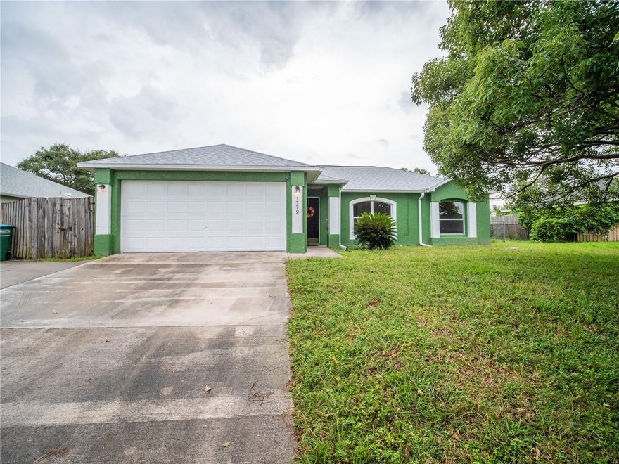 Spacious three-bedroom, two-bath, one-story block home located in Deltona Lakes. The home is situated on a generously sized lot with just under a quarter of an acre, and a large, fenced yard and no HOA. As you enter this light and bright home you are welcomed with a nice split floor plan and high ceilings. Just off the entry there’s a formal living room, followed by a formal dining room with decorative arch walls and patio access. On the opposite side of the dining room is the kitchen featuring a center island, breakfast bar, and ample cabinet and counter space. The kitchen opens perfectly to the family room where you can entertain without missing out. The owner’s suite is nicely sized, with a view of the patio and a large walk-in closet. The owner’s bath has an extended vanity, a stand-up shower, and a garden tub perfect for relaxing at the end of the day. Two additional bedrooms are ample-sized. The guest bath has shower with tub. Step outside the family room into the large screened-in tiled patio where you can relax, entertain, and enjoy the sounds of beautiful Florida. Don’t miss out on the opportunity. One year old roof.