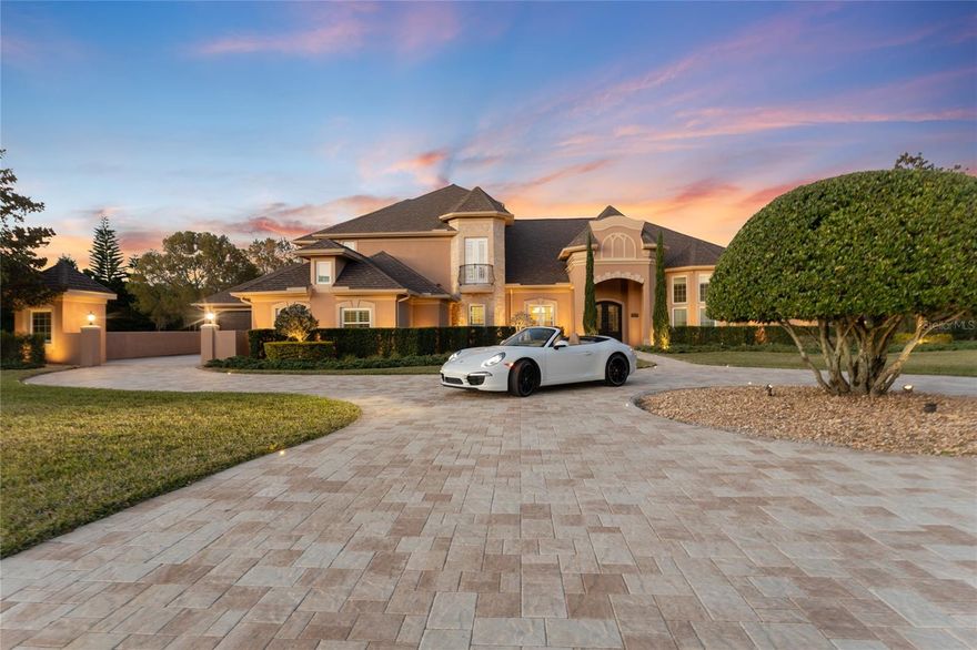 Your dream of owning an estate in the coveted, gated community of Steeplechase can now be a reality. This stunning luxury property is a masterpiece of design and craftsmanship that spans over 3.2 acres and radiates timeless elegance and exclusive luxury. The long, newly paved drive welcomes you with beautiful accent lighting and meticulous landscaping, setting a perfect first impression. Step through the elegant mahogany doors with wrought iron inserts and be greeted by soaring ceilings, breathtaking archways that tower over gleaming travertine floors, rooms awash in light, and panoramic views of the backyard and pool oasis. The home is timeless with a neutral color palette, art niches, and coffered ceilings, all tastefully chosen by an expert designer. Boasting 4 spacious bedrooms, 4.5 bathrooms, and bonus office/den, this expansive 5,251 square foot residence is a true masterpiece. With over $580,000 in upgrades, modern luxury is found in every detail. The living room features a stunning stone wall with a newly installed electric fireplace that offers a serene setting for relaxation. The newly renovated kitchen & wet bar offers quartz countertops, new stainless-steel appliances, double oven, and a built-in gas stove with stainless hood is a chef or entertainers dream. The oversized primary suite is a retreat within itself, featuring a stone wall with an electric fireplace, newly installed engineered hardwood floors, and large walk-in closets. French doors lead out to the tranquil lanai just steps from the heated pool and spa. Adding to the allure of this stunning property is a bar loft room on the second floor that can be converted into a movie theater or entertainment space. A four-car garage can hold all your toys with room to spare and features epoxy floors and built-in storage cabinets. Even the laundry room has been considered with the addition of quartz countertops and plantation shutters. Upgraded AC units (2018) with AC infrared mold lights (2021), a new roof (2018), and a leak detection technology system ensure the homes functionality is optimized for easy living. A water softener and reverse osmosis system further enhance the comfort of this home. This upscale, peaceful community is just a short drive from downtown Tampa and the Tampa airport. Your life in Steeplechase can be a reality. Call to schedule your private showing. The upstairs bar/media room has virtually staged photos.