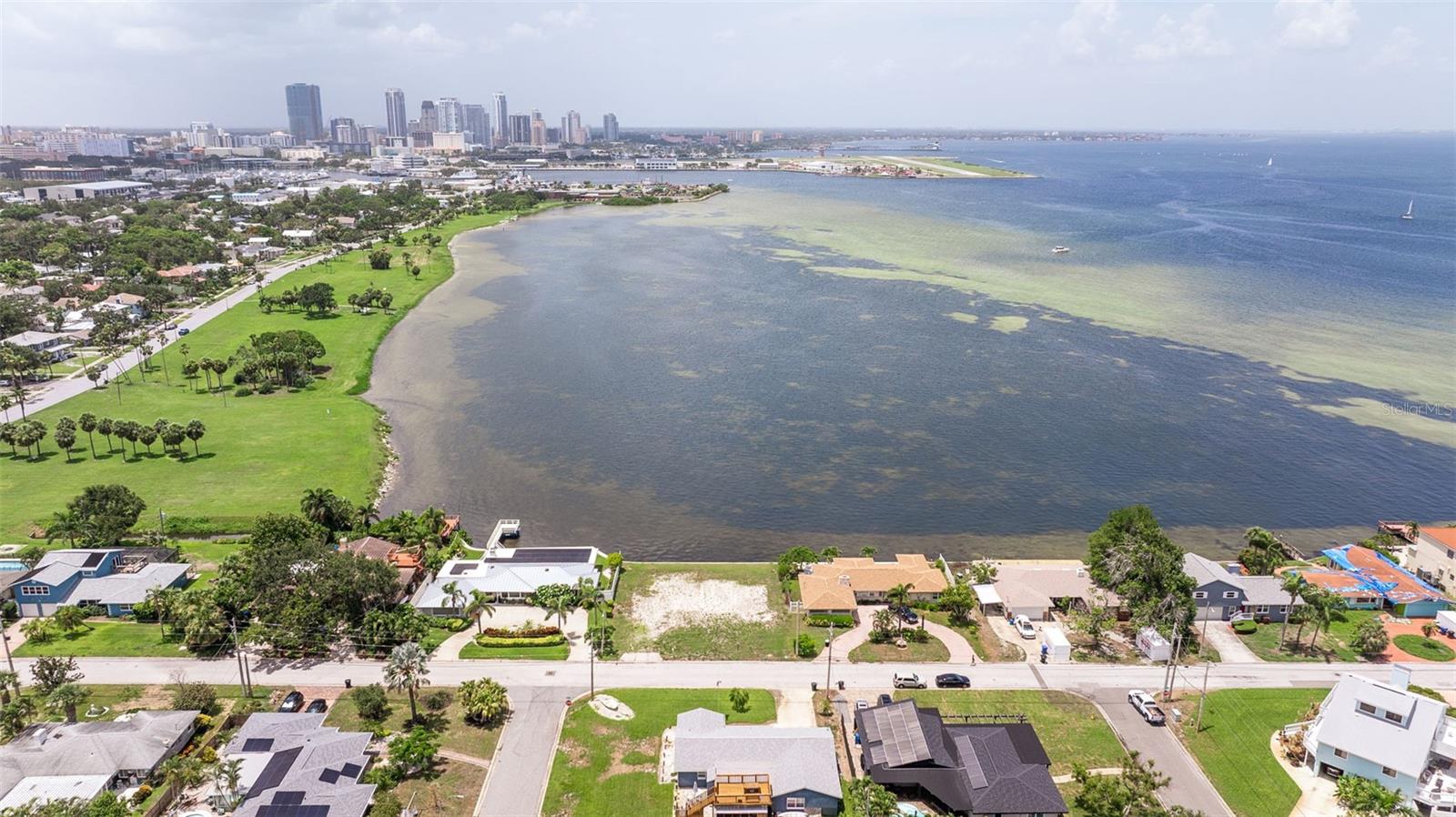 Welcome to your very own slice of paradise in the delightful Tropical Shores! This rare lot is a canvas just waiting for your dream home masterpiece, boasting breathtaking panoramic views of the ever-evolving downtown St. Petersburg skyline. Imagine sipping your morning coffee while soaking in the magical sights of marine life and vibrant birds that come to visit you daily—it’s like having a front-row seat to nature’s own spectacular show!
This generous lot measures an impressive 100 feet deep and 90 feet wide, offering you ample space to let your imagination run wild. Want to add a dock? You sure can! Check with the City of St Petersburg for permitting rules. (just a heads up, no boat lifts allowed).
And let’s not forget Lassing Park, stretching majestically over 14 acres, with fishing spots, kiteboarding, and surfing launch areas right at your fingertips. Picture this: your backyard is an open invitation to all the wonders of the outdoors!
So, what are you waiting for? Grab your ideas and sketch out that dream home you’ve always wanted. Schedule your private viewing today and start imagining the incredible lifestyle that awaits you in this beautiful coastal paradise!