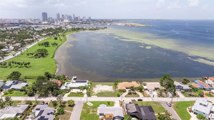 Welcome to your very own slice of paradise in the delightful Tropical Shores! This rare lot is a canvas just waiting for your dream home masterpiece, boasting breathtaking panoramic views of the ever-evolving downtown St. Petersburg skyline. Imagine sipping your morning coffee while soaking in the magical sights of marine life and vibrant birds that come to visit you daily—it’s like having a front-row seat to nature’s own spectacular show!

This generous lot measures an impressive 100 feet deep and 90 feet wide, offering you ample space to let your imagination run wild. Want to add a dock? You sure can! Check with the City of St Petersburg for permitting rules.  (Just a heads up, no boat lifts allowed). You can however launch paddleboards, kayaks and canoes. 

And let’s not forget Lassing Park, stretching majestically over 14 acres, with fishing spots, kiteboarding, and surfing launch areas right at your fingertips. Picture this: your backyard is an open invitation to all the wonders of the outdoors! 

So, what are you waiting for? Grab your ideas and sketch out that dream home you’ve always wanted. Schedule your private viewing today and start imagining the incredible lifestyle that awaits you in this beautiful coastal paradise!
