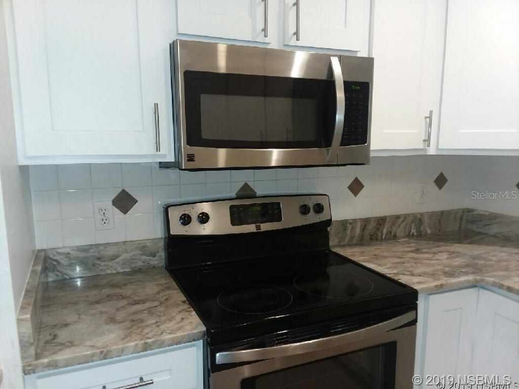 Photo of 572 Palm Drive, New Smyrna Beach, FL 32168 (MLS # NS1088057)