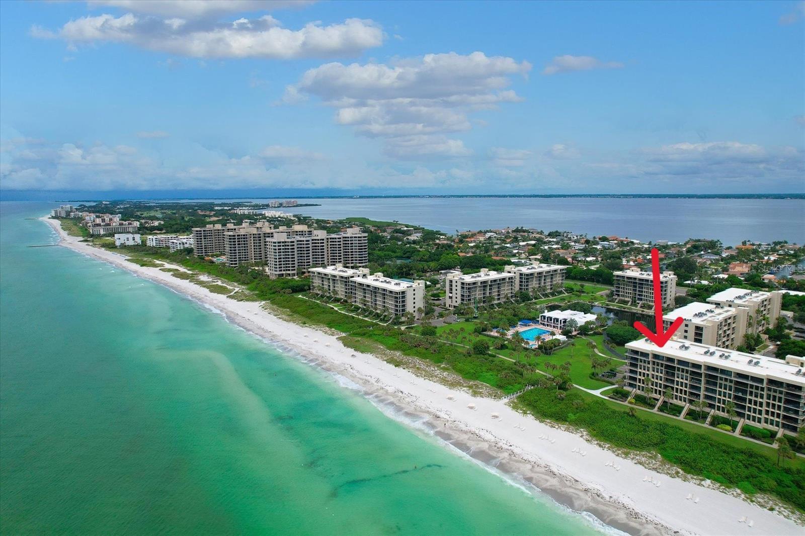 Your Beachfront Oasis Awaits! Unobstructed views of the Gulf of Mexico and Direct access to the beach! Welcome to your perfect getaway at Beachplace, nestled on the world-renowned sands of Longboat Key, just minutes away from the vibrant St. Armands Circle and lively downtown Sarasota. This Resort Style Community offers an array of amenities, including 24/7 manned guard gate, on-site management and maintenance staff, recently renovated Olympic-sized heated pool with lap lanes, heated small pool, spa, fitness center, Har-Tru tennis court day and night, pickleball courts, ping pong, barbeque grilling areas, clubhouse, electric car charging stations, and car wash. The beautifully landscaped grounds are enhanced with lush tropical surroundings and serene walking paths. Umbrellas and lounge chairs for the beach are provided by the Beachplace community.
This completely renovated unit is located on the 4th floor reached by elevator or stairs. Recently remodeled, including new entry doors, hurricane proof windows, new flooring, paint, ceiling texture, recessed lighting, new appliances, Quartz counters and new bath vanities. It features spacious living area, thoughtfully designed for comfort and style, where the open concept living room seamlessly connects to the lanai, offering an indoor-outdoor retreat with panoramic ocean views; kitchen with laundry and pantry closets, large island and window for added ventilation; storage or office as an extra space; roomy guest bedroom with attached bathroom, also accessible from the hallway; breathtaking 180-degree Gulf water views from master bedroom with private doors to access the balcony, ensuite bathroom with plenty of closet space, and double vanity. This gorgeous property was used by owners for their vacations and rented for the season. Sold turnkey furnished except for the wall art and some personal items.
