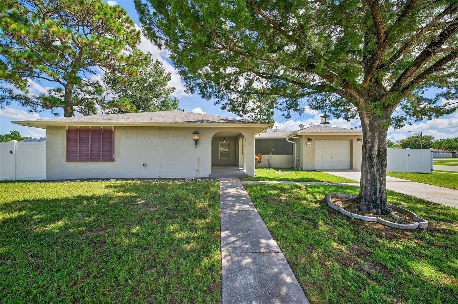 Spacious Pool Home on Corner Lot. Large pool home for under 400,000!!! Your Dream Florida Retreat Awaits!
Welcome to your future oasis! Situated on a generous .40-acre corner lot that has been newly fenced. This charming home immediately captures attention with its alluring arches and impressive curb appeal.
Step inside to discover a thoughtfully designed open floor plan with abundant natural light, brand-new flooring, and a layout perfect for everyday living and entertaining. The sprawling living room offers endless possibilities for relaxation and gatherings, while the oversized primary bedroom provides a true retreat after a long day.
Host memorable dinners in the formal dining room, which seamlessly flows into the unique bricked kitchen—a cook’s dream with plenty of cabinet and counter space to meet all your culinary needs.
Need extra space to work or unwind? Just off the living area, you’ll find a versatile office or den, perfectly positioned next to the 480 sq ft pool deck. Whether you're hosting lively pool parties or enjoying quiet weekend mornings, this outdoor space could easily become your favorite spot.
Additional highlights include:
2017 AC unit
2020 gas water heater
Gas stove
Close proximity to Hudson Beach, shopping, and more
The seller didn’t plan on relocating, so their recent updates are your gain—this move-in ready pool home offers exceptional value, space, and character all in one package.
At this price, you simply won’t find a better opportunity. Schedule your showing today before it’s gone!