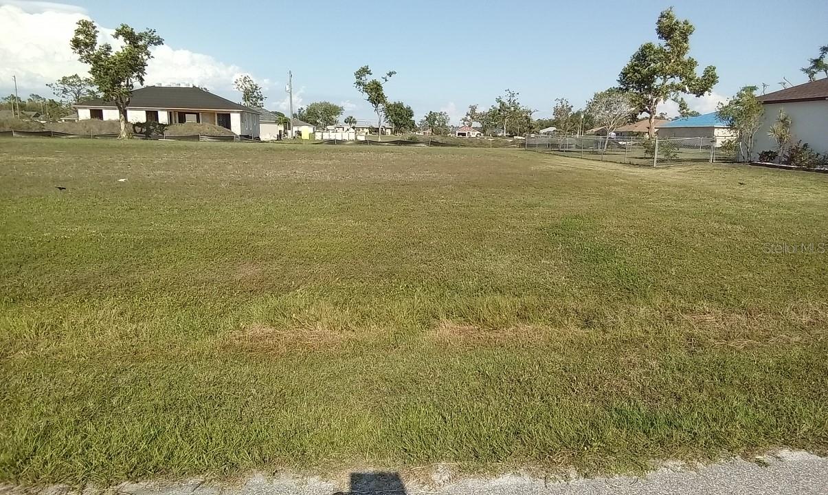 No wetland, no burrows, no slope, on a paved road with power at the site, water & sewer available. .22 acre lot located in desirable Punta Gorda surrounded by existing homes, in a very nice neighborhood. The lot is 15 minutes away from the Burnt Store Marina, which features a 27-hole executive golf course and only a short drive to historic downtown Punta Gorda. Close to stores and restaurants. Do not wait and build your dream home. Invest now.
