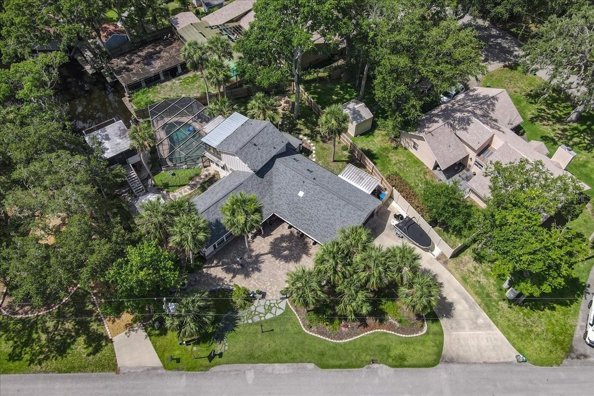 Private Canal-Front Pool Home in Ormond Beach – No HOA
Welcome to this custom-built canal-front pool home located in a quiet, desirable area of Ormond Beach—just 15 minutes to the beach and close to shopping, dining, and major roadways. This unique property offers privacy, charm, and direct water access with no HOA restrictions.
As you enter through the gated pavered courtyard, you’ll find a thoughtfully designed layout that blends comfort and functionality. The spacious family room features custom built-ins, a fireplace, and cozy window seating with views of the lush backyard and canal. The upgraded kitchen includes granite countertops, a gas range, stainless steel appliances, a coffee bar, and a breakfast bar perfect for entertaining. A sitting area off the kitchen overlooks the screened pool and tranquil waterfront.
This home features three full bedrooms and two fully renovated bathrooms. The primary suite includes water views and an en-suite bath. Upstairs, a versatile flex room with its own A/C and balcony offers the perfect space for an office, gym, or studio.
Enjoy the Florida lifestyle with a private pool, boat lift, and a rare two-story boathouse with potential for additional living or recreational space. From your backyard, kayak or boat to nearby River Grille in minutes. The surrounding canal system features scenic coves and natural preserves where blue herons and egrets often nest—offering a peaceful and picturesque backdrop.
Additional features include:
• Concrete block construction
• Fully fenced yard
• Ample storage
• No HOA or deed restrictions
New Roof 2022, New windows in summer room 2023, New Elecrical panal box 2023, New boat lift 2023 (6000# lift) New dock with marine lumber 2023, new pool skimmer 2024, Entire home just painted, This home is MOVE IN READY!!!!
An upgrade list is attached under documents and a few new items include, gutter leaf guards around the home, new mailbox, new lamp post and exterior lighting. The boat is available for sale also.
This is a rare opportunity to own a private waterfront retreat in a sought-after location.
