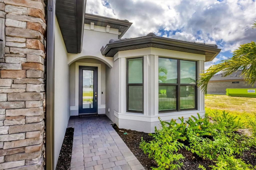 Photo of 4400 Lakeside Grove Place, North Port, FL 34289 (MLS # C7515023)
