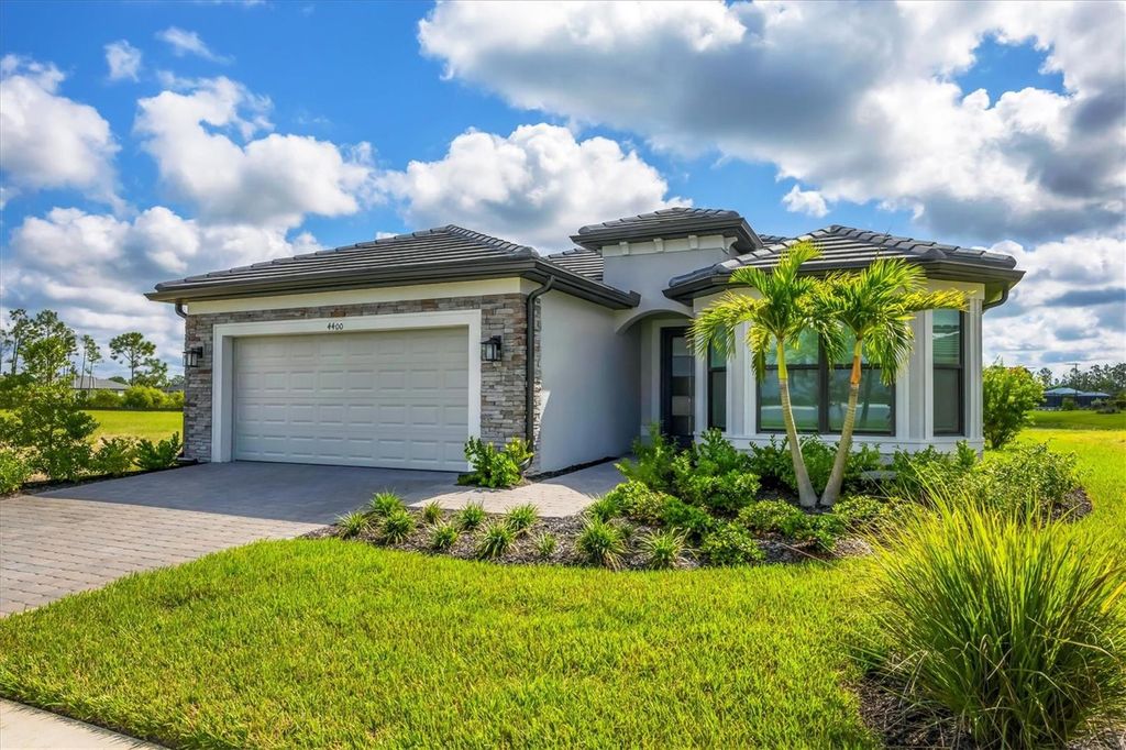 Photo of 4400 Lakeside Grove Place, North Port, FL 34289 (MLS # C7515023)