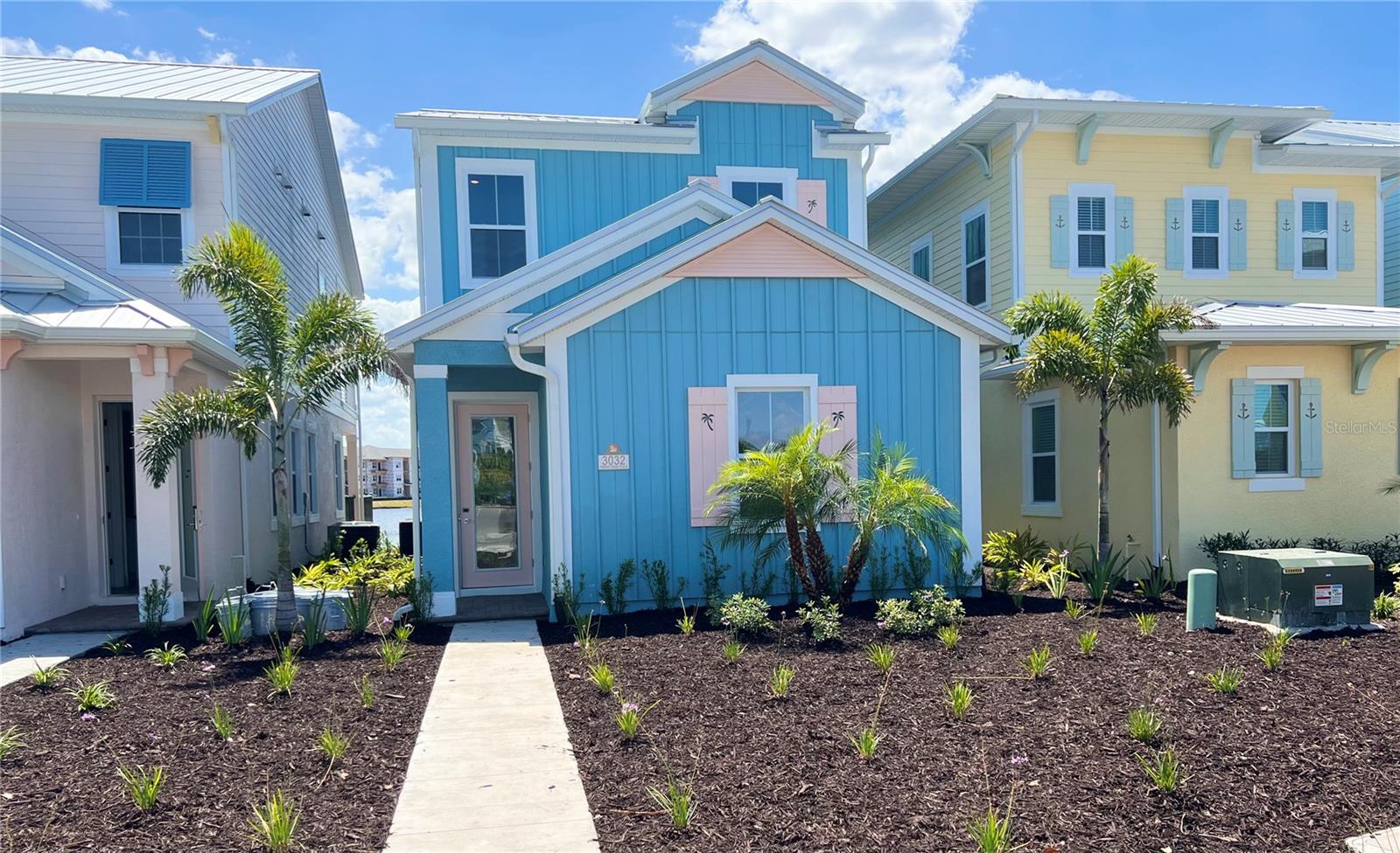 RARE WATERFRONT COTTAGE WITH POOL, SPACIOUS 1746-A Model, 3 Bedrooms, 3 Full Bathrooms with MRO APPROVED CITY FURNITURE "Key West Sunset" Package, METAL ROOF, LARGE PATIO AND BALCONY with Spectacular SUNSET VIEWS! ONLY 7 OF THIS MODEL WERE BUILT IN THE ENTIRE RESORT IN 2022! One Bedroom Downstairs with Full Bathroom and Walk In Closet. Second Bedroom Upstairs has 2 Twin Beds, Primary Bedroom with King Bed and Sliding Door Leading to Large Balcony with Amazing Views. Living Room has Sliding Glass Doors that Lead to Fenced In Patio with a Heated Spool Pool and Amazing Water Views. Kitchen has Island with Seating, Upgraded 'Wood' Tile Floors Throughout the Home, QUARTZ Countertops, High Capacity W/D. Furniture Package is INCLUDED in List Price! Furniture Package Includes Blinds, Drapes, TVs, Artwork, Kitchen Necessities, Dishware, Linens, and so MUCH MORE! This is a Wonderful Community to Live in Full Time, Own a Second Home or Invest in a Vacation Rental Property! This Unique First of its Kind Resort has Multiple Pools, Gym, On-Site Water Park, Sunset Walk Restaurants, Bars, Live Music, Retail and More! LOCATED MINUTES FROM DISNEY PARKS!, All While Being Conveniently Close to The Best Shopping, Dining, And Entertainment Options in Florida.