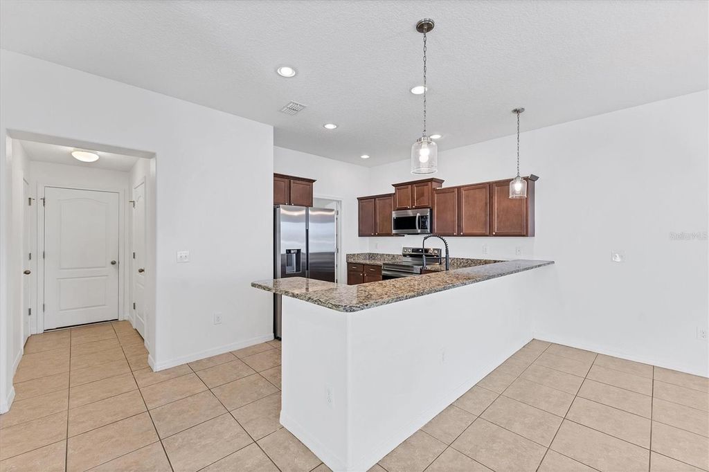 Photo of 910 Seminole Sky Drive, Ruskin, FL 33570 (MLS # A4660276)