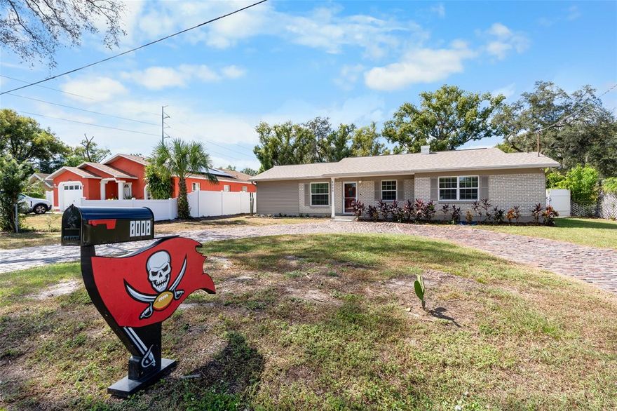 Welcome to your fully remodeled Tampa retreat! Every inch of this home has been thoughtfully updated, including a 2023 roof, new windows, modern flooring, lighting, and fresh paint throughout. The open-concept layout flows seamlessly into a spacious bonus room, perfect for a home office, gym, or playroom. As you pull into the circular brick driveway, you’ll notice the historic pavers — a unique touch of Tampa’s history, repurposed from the city’s original roadways to blend charm with character. The stunning 0.34-acre fenced backyard is a rare find inside city limits, offering endless possibilities — add a pool, build a guesthouse or income-producing ADU, or simply enjoy the ultimate outdoor living space. The impressive outdoor kitchen features a built-in commercial-grade grill, four-burner cooktop, pizza oven, and fire pit, creating the perfect setting for entertaining. Additional highlights include an oversized swing gate with RV and boat access, a 120-gallon propane tank (generator-ready), and a fully powered workshop ideal for tools or hobbies. Nestled on a quiet street in Silver Lake Estates, this property offers convenient access to Downtown Tampa, Raymond James Stadium, Tampa International Airport, shopping, restaurants, and Gulf beaches. Security upgrades include an ADT alarm system, two Ring floodlight cameras, and a Ring video doorbell. With no HOA, this move-in ready home combines modern comfort, outdoor living, and a touch of Tampa history — truly a one-of-a-kind property in the heart of the city.