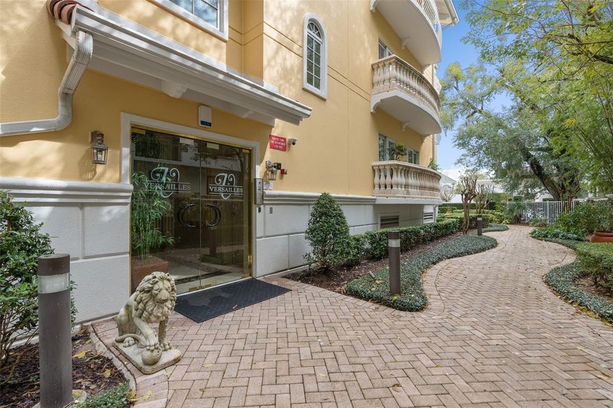 Versailles of Winter Park stands as an epitome of exclusive luxury, strategically located mere steps away from the vibrant ambiance of Park Avenue, renowned for its eclectic array of dining, shopping, and special events. A rare opportunity, this distinguished property offers only seven private residences, each boasting expansive one-level living spaces spanning over 3000 square feet, complete with private two-car garages.
Upon entering through the secure guest lobby, an elevator ride ascends to the elegant fourth-floor lobby, exclusively serving the two private homes on the floor. As the doors of Residence #400 swing open, guests are greeted by an atmosphere of refined sophistication. Oak wood floors, soaring ceilings exceeding 9 feet, and intricate crown moldings adorn the spacious living area, complemented by a wall of custom built-ins illuminated with accent lighting and expansive windows & French doors ushering in abundant natural light. A wet bar niche, equipped with a sink, beverage refrigerator, and storage, seamlessly integrates into the living space, facilitating effortless entertainment, while a charming outdoor terrace, adorned with Chicago brick and stone railing, extends the living area outdoors, fostering an enchanting indoor-outdoor experience.
A highlight of this residence is the impeccably redesigned and renovated kitchen, boasting custom shaker-style cabinetry, bespoke templated concrete countertops infused with terrazzo, marble, and stone, and a striking counter-to-ceiling marble backsplash. High-end appliances by Subzero and Wolf, including an induction cooktop and integrated microwave drawer, grace the culinary space, accompanied by a built-in breakfast nook bench and a truly custom statement hutch for showcasing cherished collections.  The adjoining dining room is impressive & features a built-in buffet for serving/storage & can easily accommodate a table for 10-12.  With the versatility the floor plan offers, this space is currently being used & works well as a den & media room.  
A bonus is the designated office boasting rich wood wall-to-wall built-ins. Privacy is assured by the split-bedroom layout, with the expansive primary suite separated & accessible via a double-door vestibule entrance. This luxurious retreat showcases vaulted ceilings, a wall of custom cabinetry, a private balcony, and an opulent bath with dual marble vanities, a spa tub, a separate shower, and a spacious walk-in closet.
You will find the additional bedrooms are very comfortably sized with the spacious 2nd bedroom featuring extensive custom cabinetry, shelving & a built in desk with French doors to side balcony. The 3rd bedroom has wood floors and access to balcony also. Both additional baths have custom vanities with marble counters. The residence further delights with four balconies offering outdoor retreats, newly refinished hardwood floors, a freshly repainted garage interior with storage.
Surrounded by meticulously maintained landscaping, well-kept walkways, and a charming patio area, the property epitomizes elegance and tranquility. Don't miss the opportunity to reside in one of Winter Park's most coveted addresses, adjacent to the esteemed Alfond Inn & Spa, and embrace the exceptional lifestyle this residence affords. Room Feature: Linen Closet In Bath (Primary Bedroom).